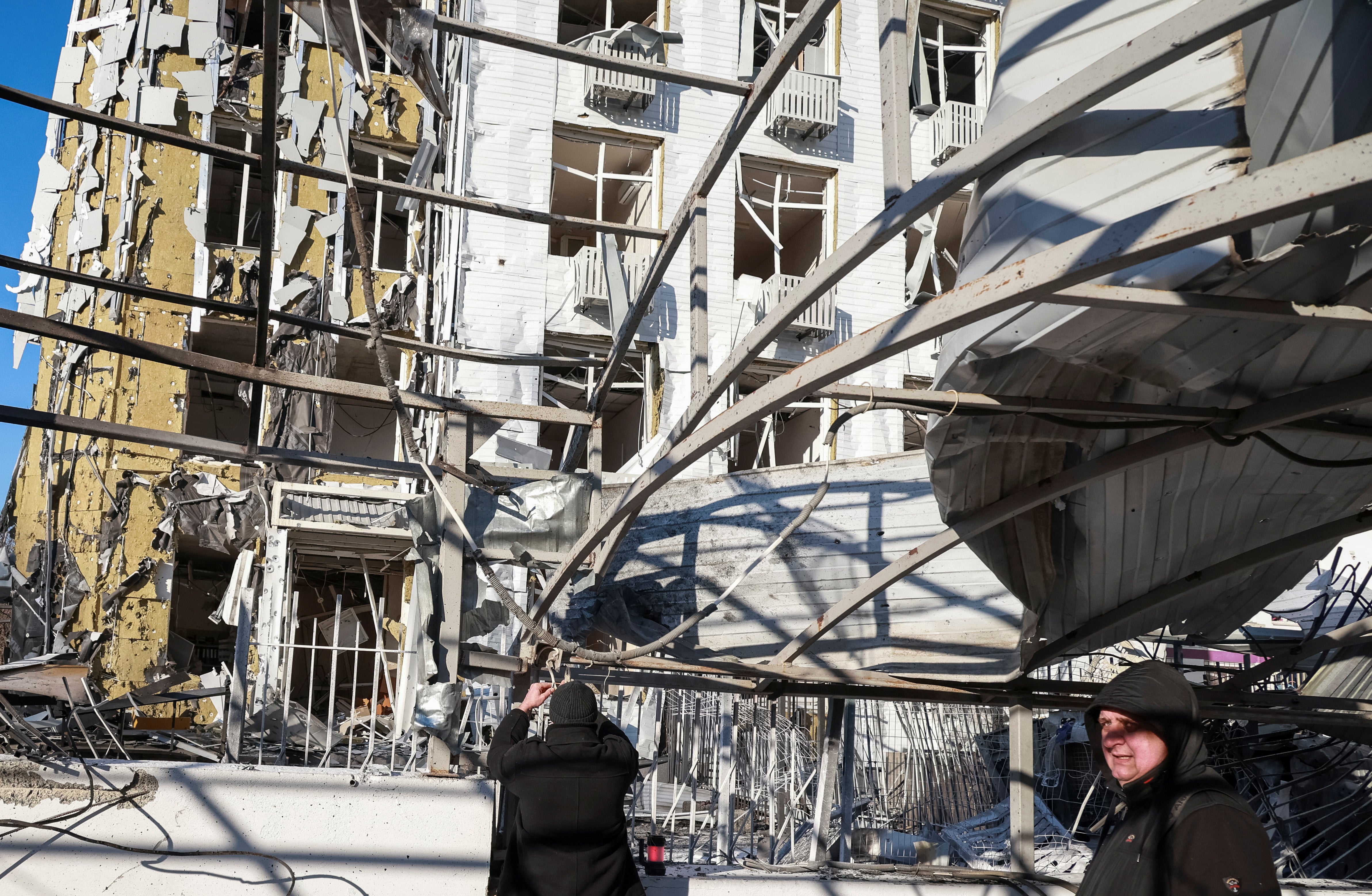 Residents of Ukraine’s Odesa stand outside a clinic that was hit by a Russian strike