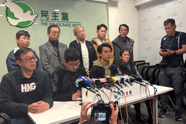 <p>Hong Kong Democratic Party chair Lo Kin Hei, seated second from right, at a press conference on 20 February 2025</p>