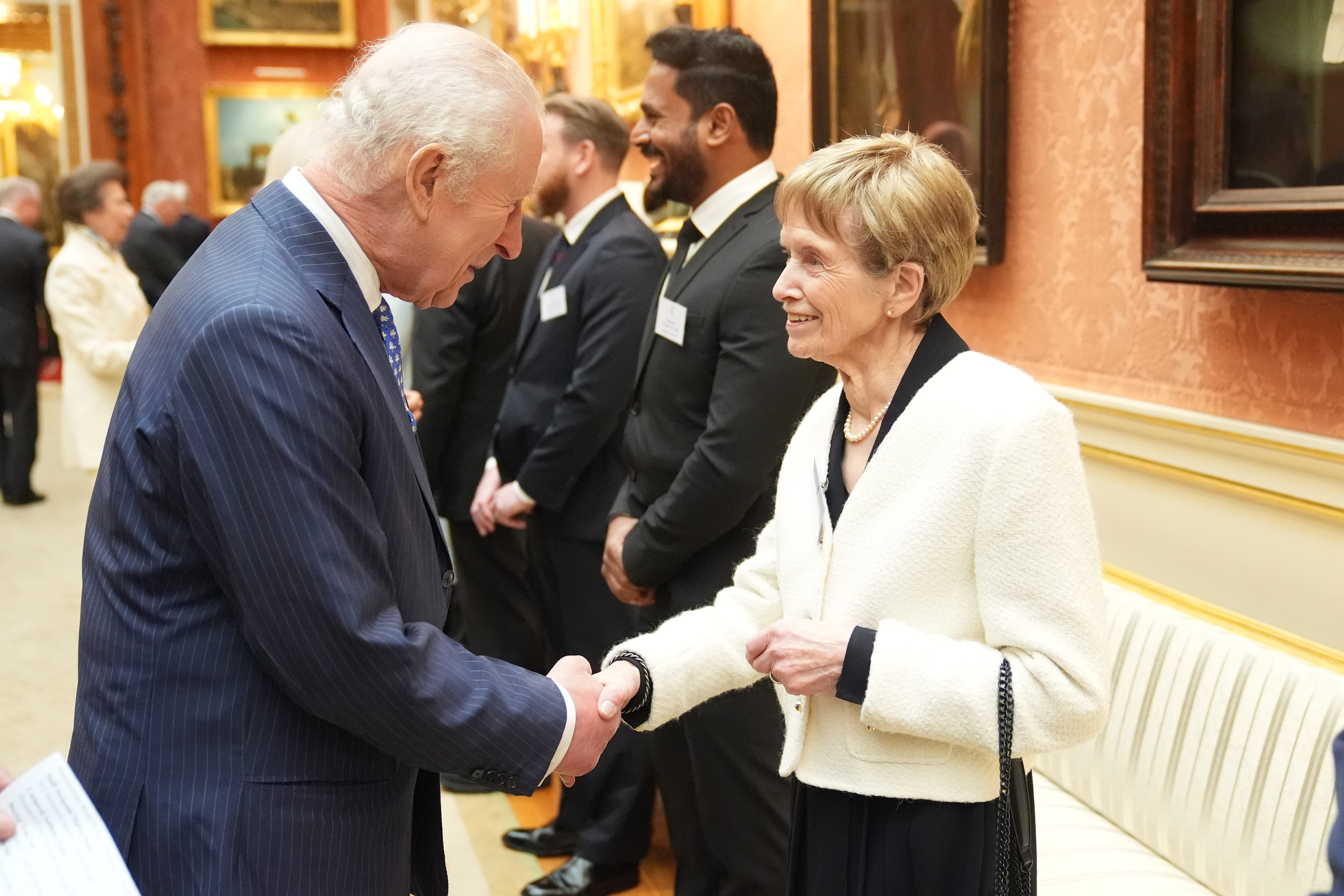 The King met Nellie Hill who opened a shop in 1992 which has raised more than £1 million for concern Worldwide (Yui Mok/PA)