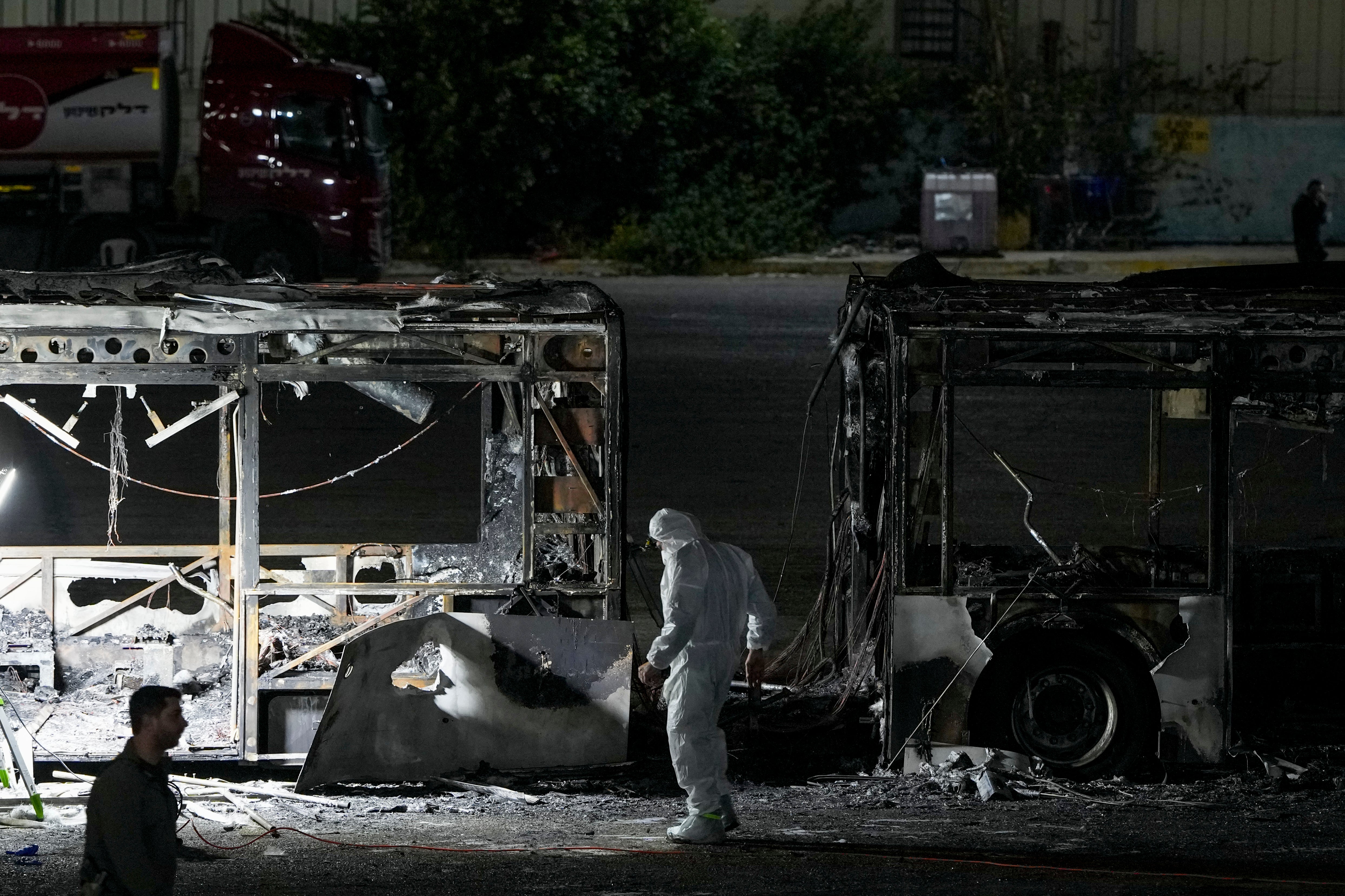 Israeli police inspect the scene of one of a series of bus explosions