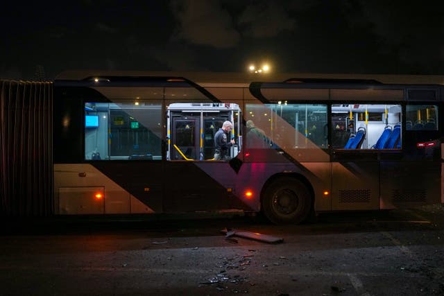 <p>Israeli police search a bus following explosions being treated as a terror attack</p>