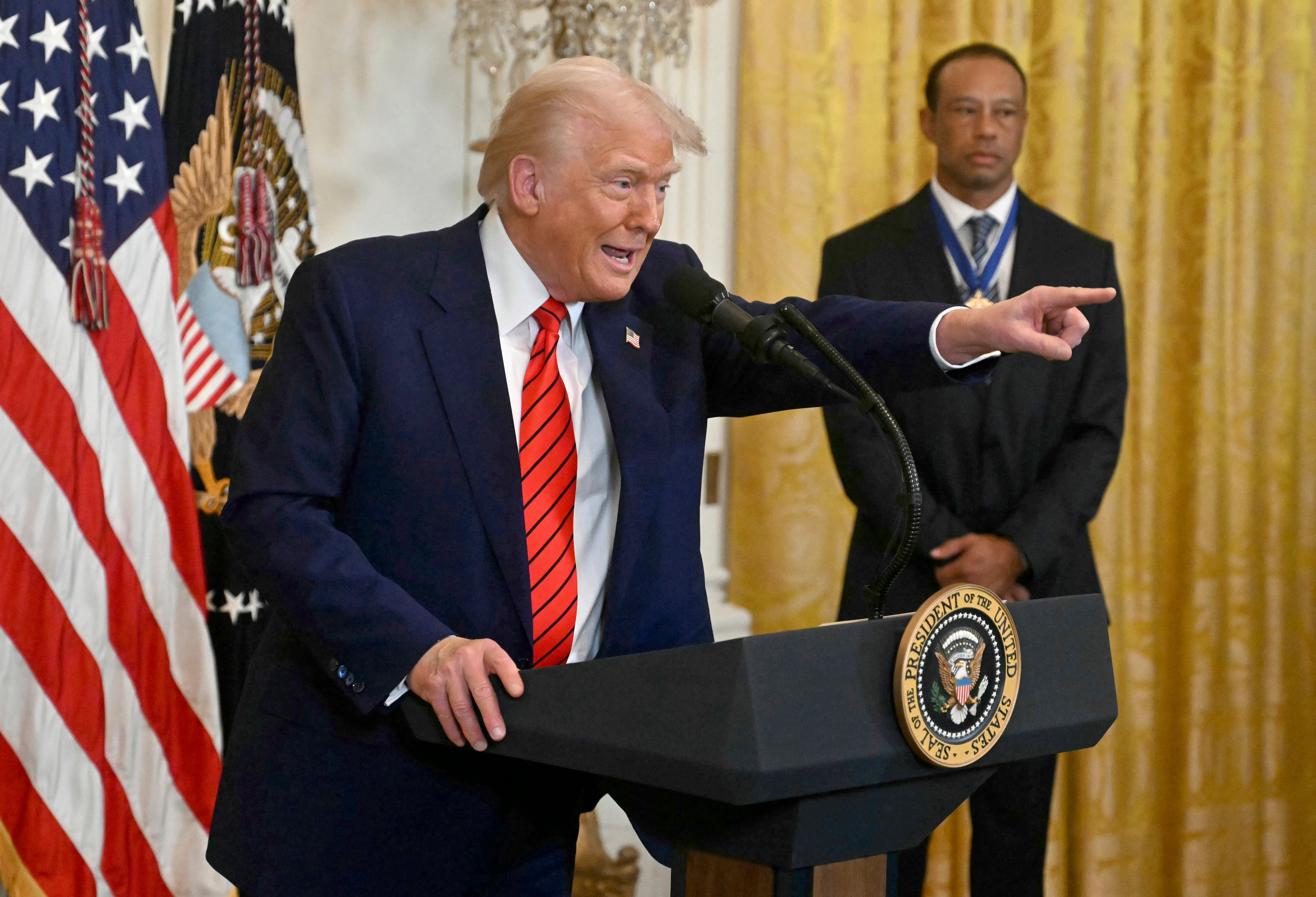 Tiger Woods joined Donald Trump for his brief remarks to recognize Black History Month at the White House on February 20