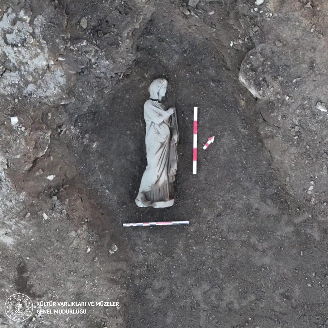 Statue of woman draped in tunic