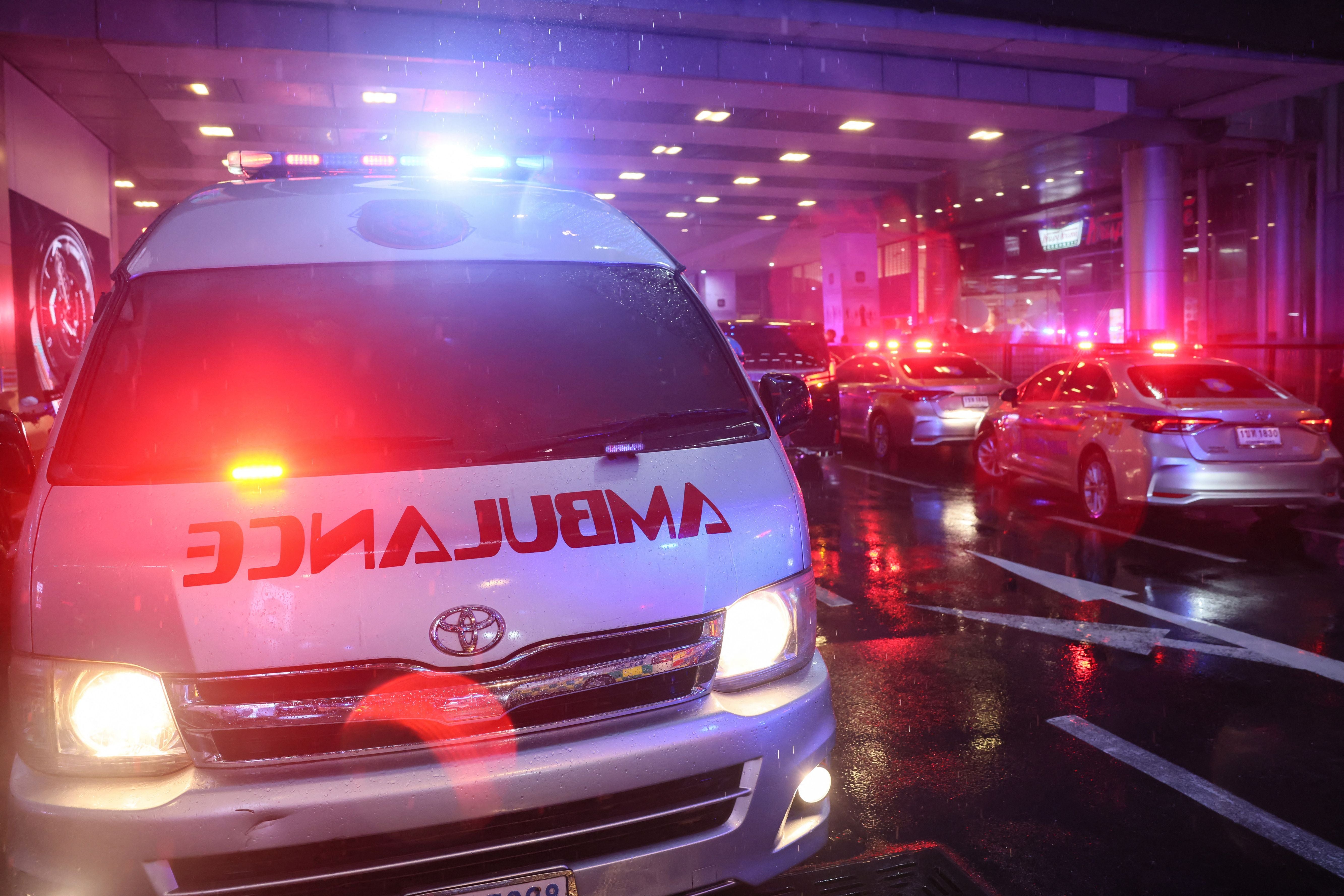 Representational. An ambulance crosses through traffic in Bangkok