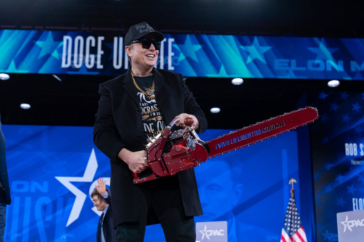 Musk says his ‘mind is a storm’ as he waves chainsaw on stage in bizarre CPAC appearance