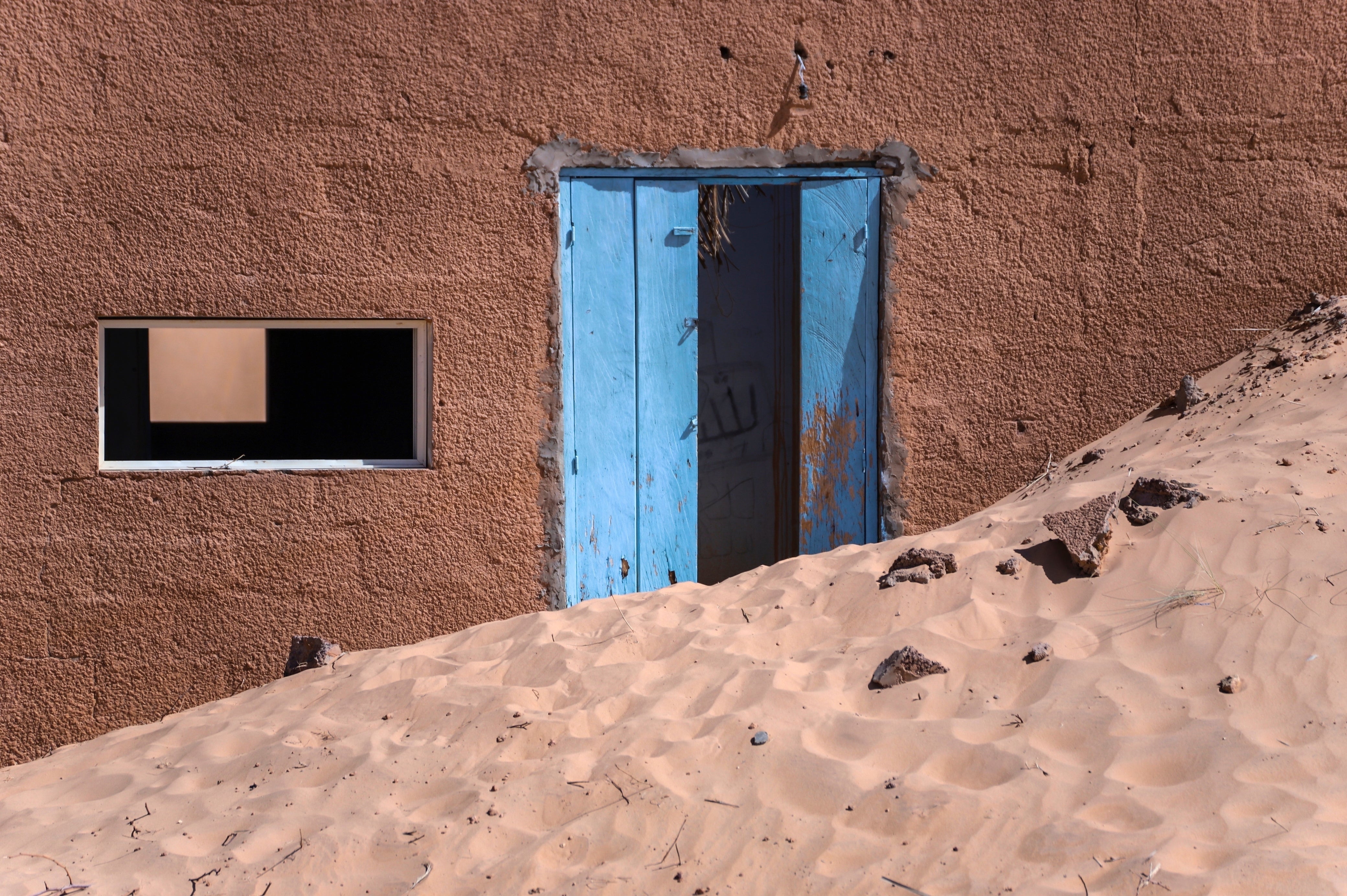 An abandoned house sits in sand near Chinguetti, Mauritania on Jan. 13, 2025