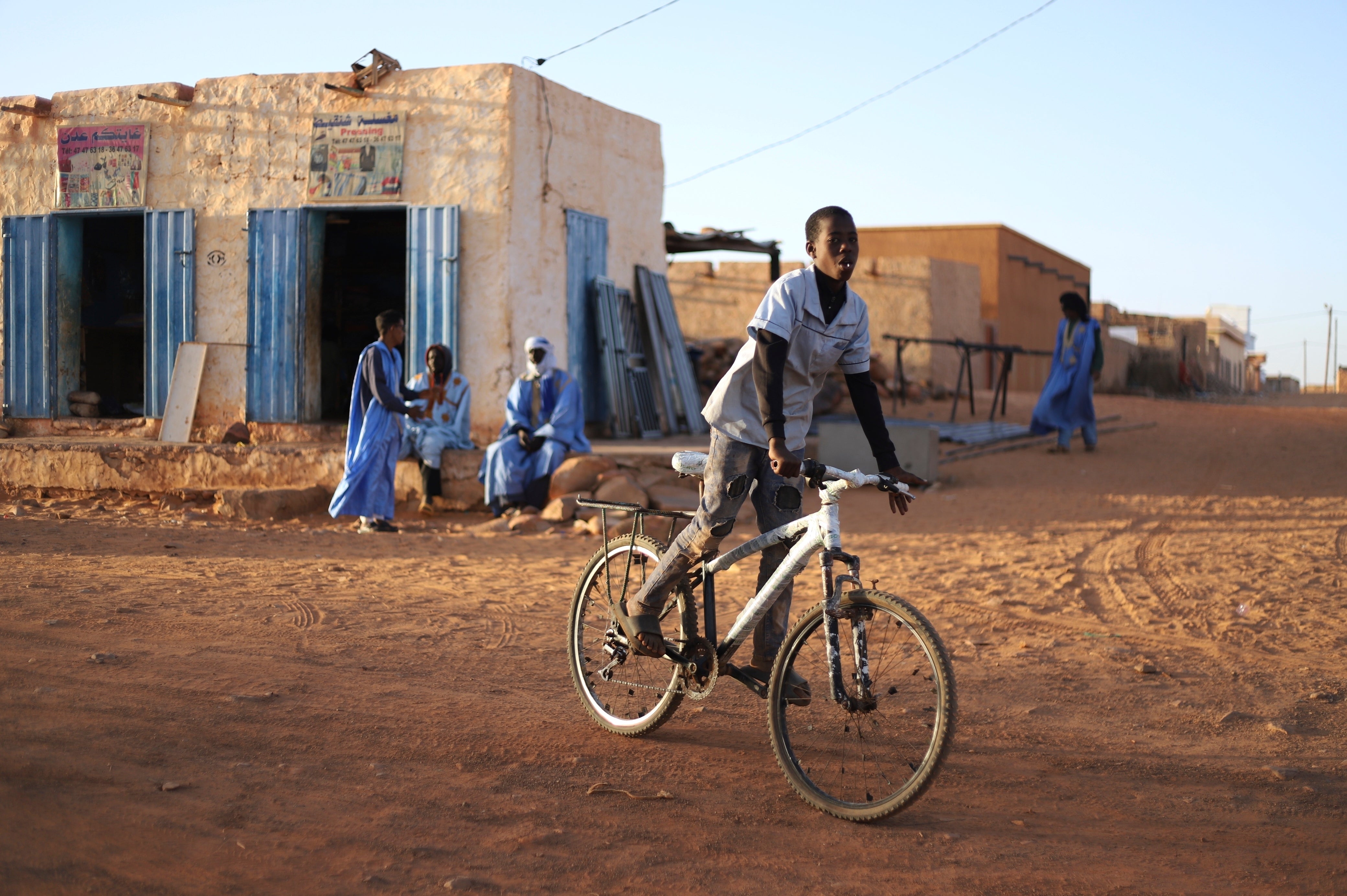 A child rides his bike in Chinguetti, Mauritania on Feb. 4, 2025