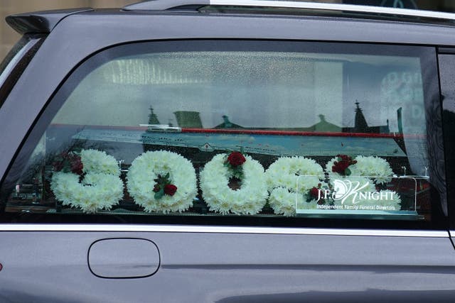 Flowers in the hearse carrying the coffin of Harvey Willgoose (Peter Byrne/PA)