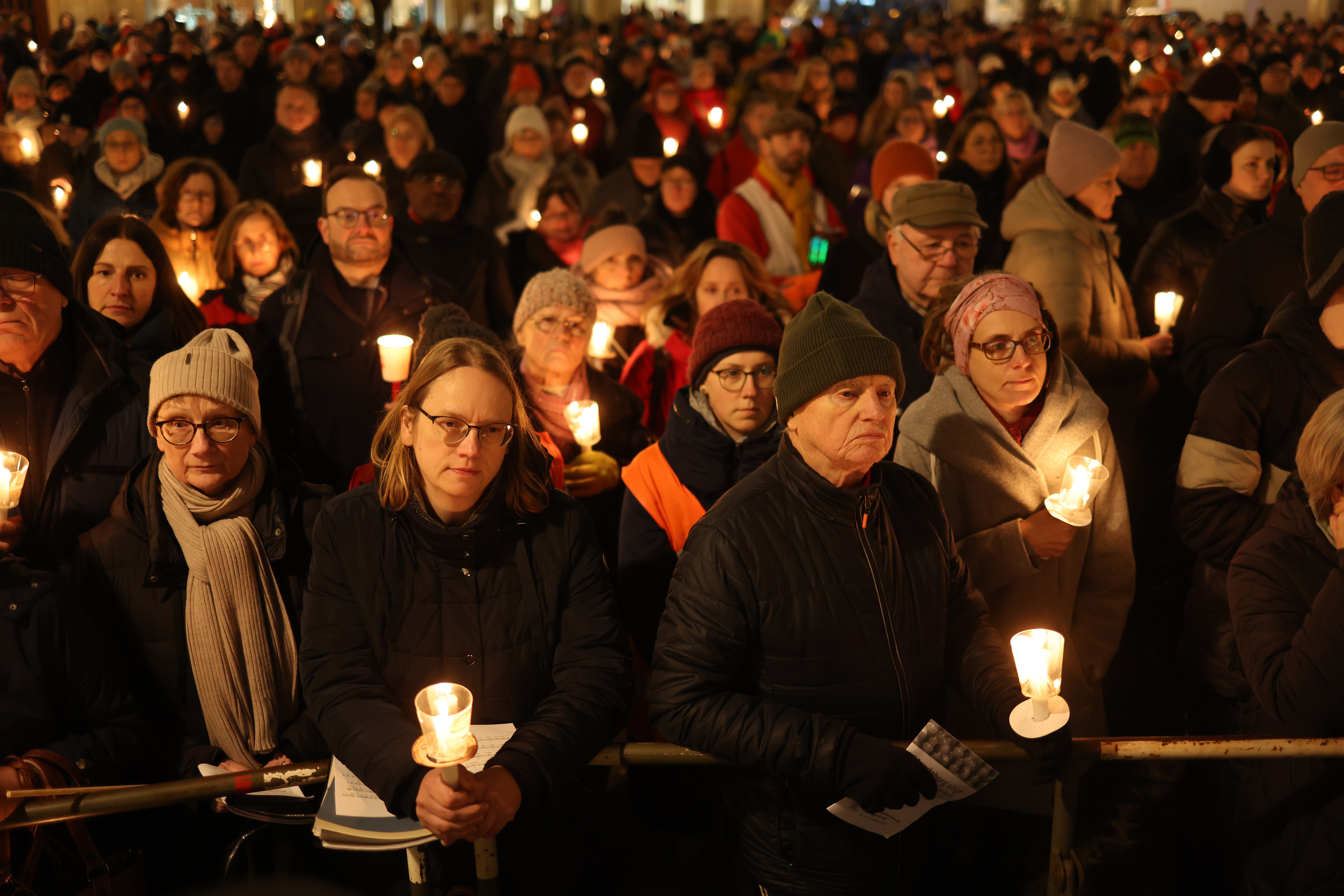 People gather with candles on Alter Markt square last month to commemorate the victims of the Christmas market attack in Magdeburg, Germany