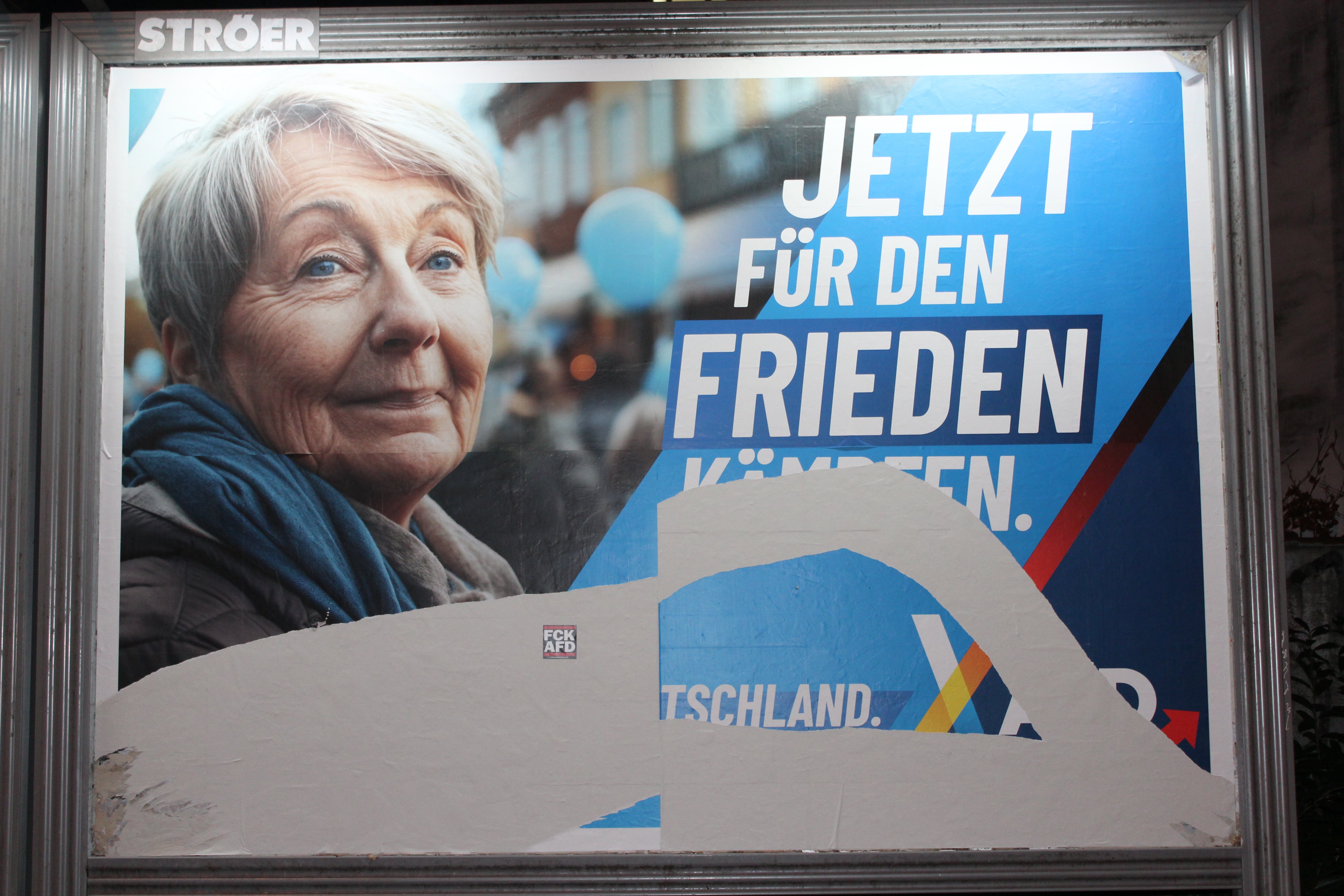 An Alternative for Germany (AfD) poster is defaced in Munich