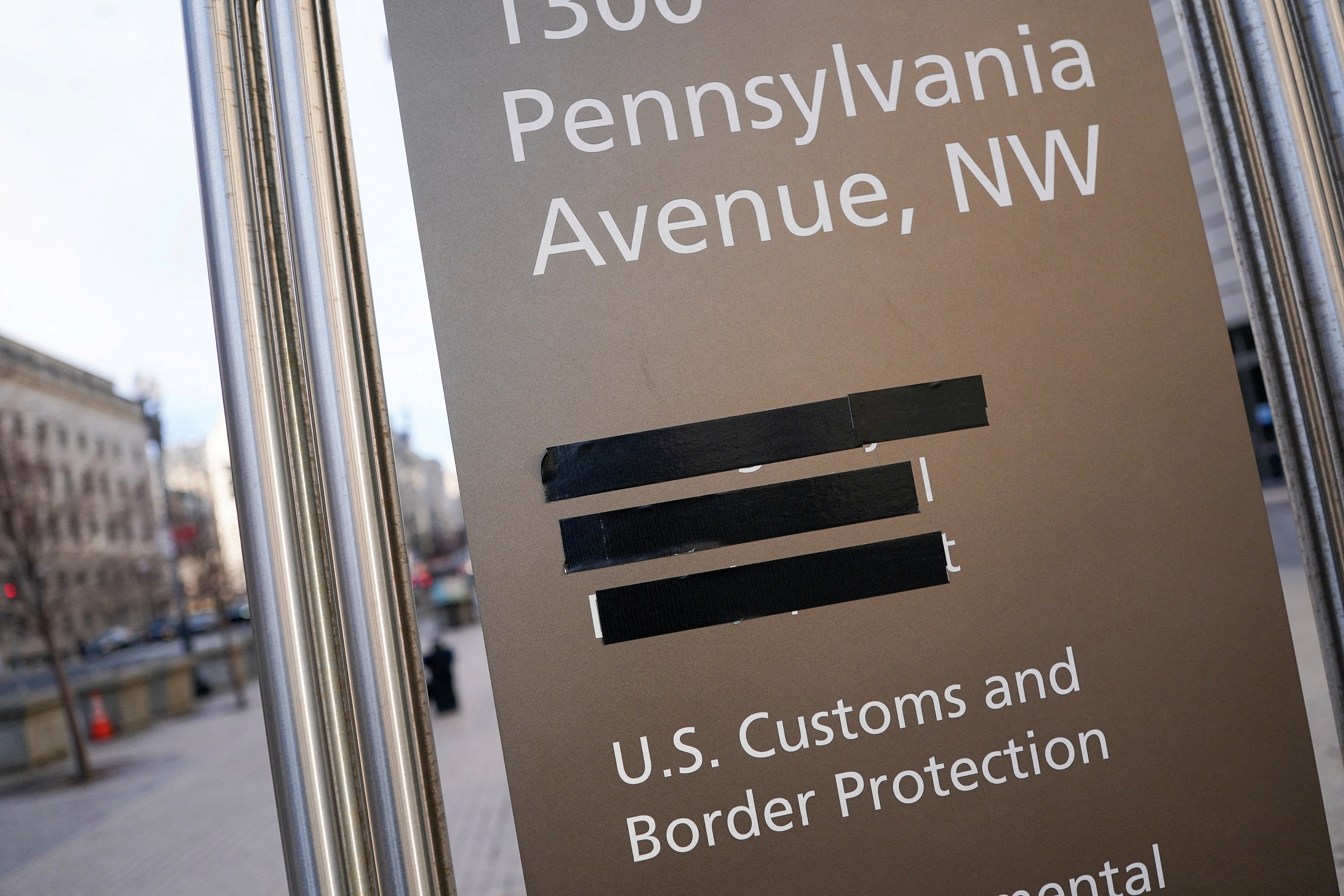 USAID signage is covered by black tape outside the Washington office