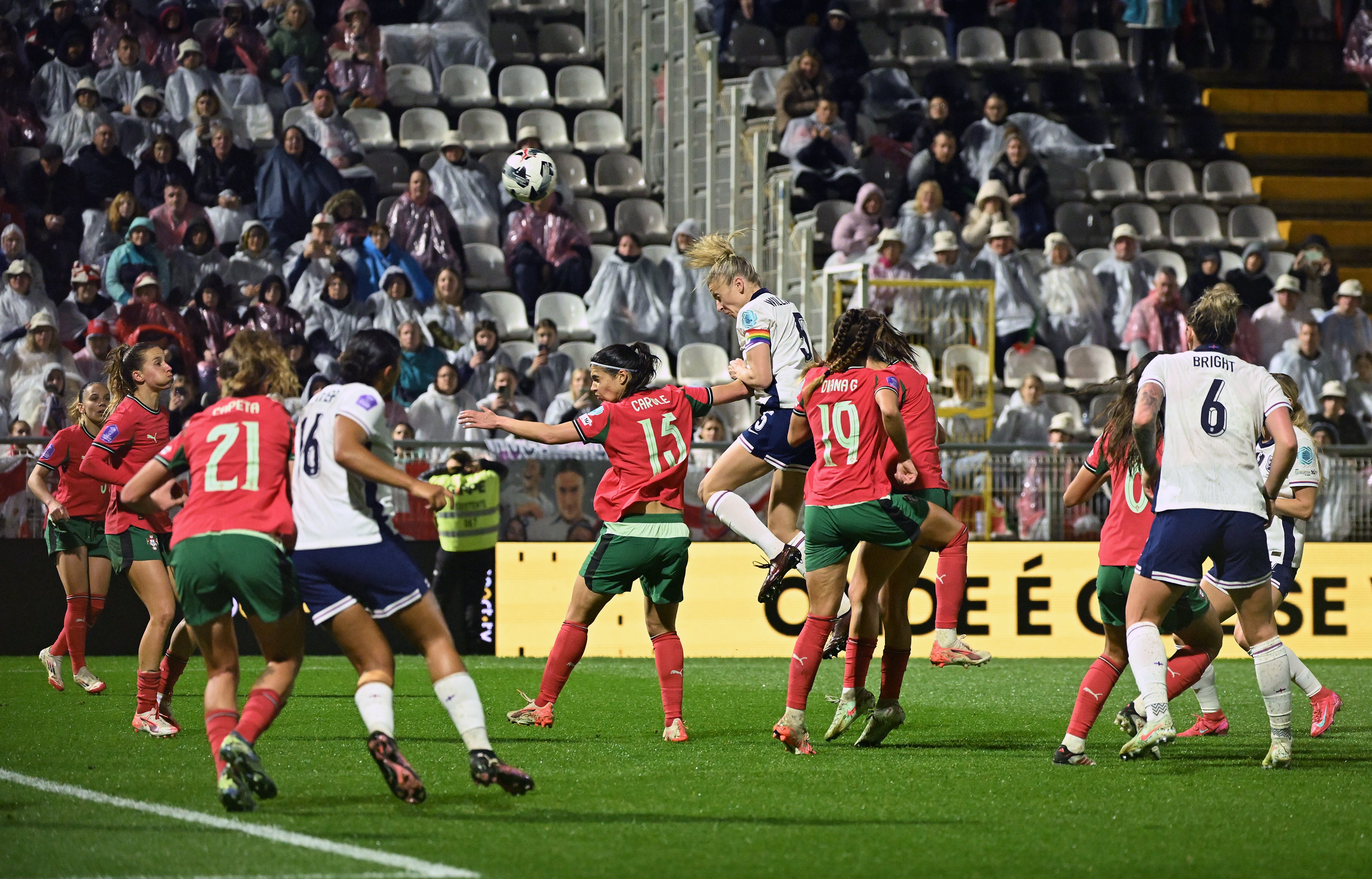 Leah Williamson heads the ball towards the Portuguese goal