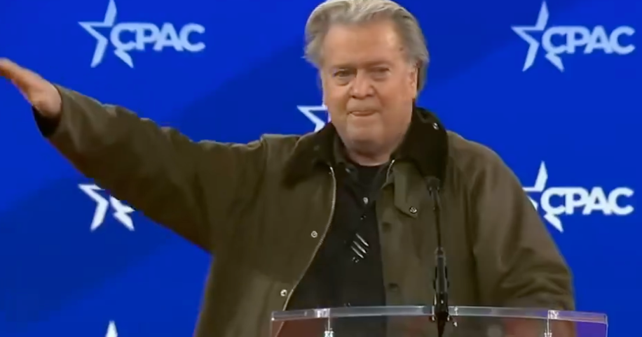 Extreme-right podcaster and Donald Trump's former White House strategist Steve Bannon appears to flash a Nazi salute during his speech Thursday at CPAC in National Harbor, Maryland