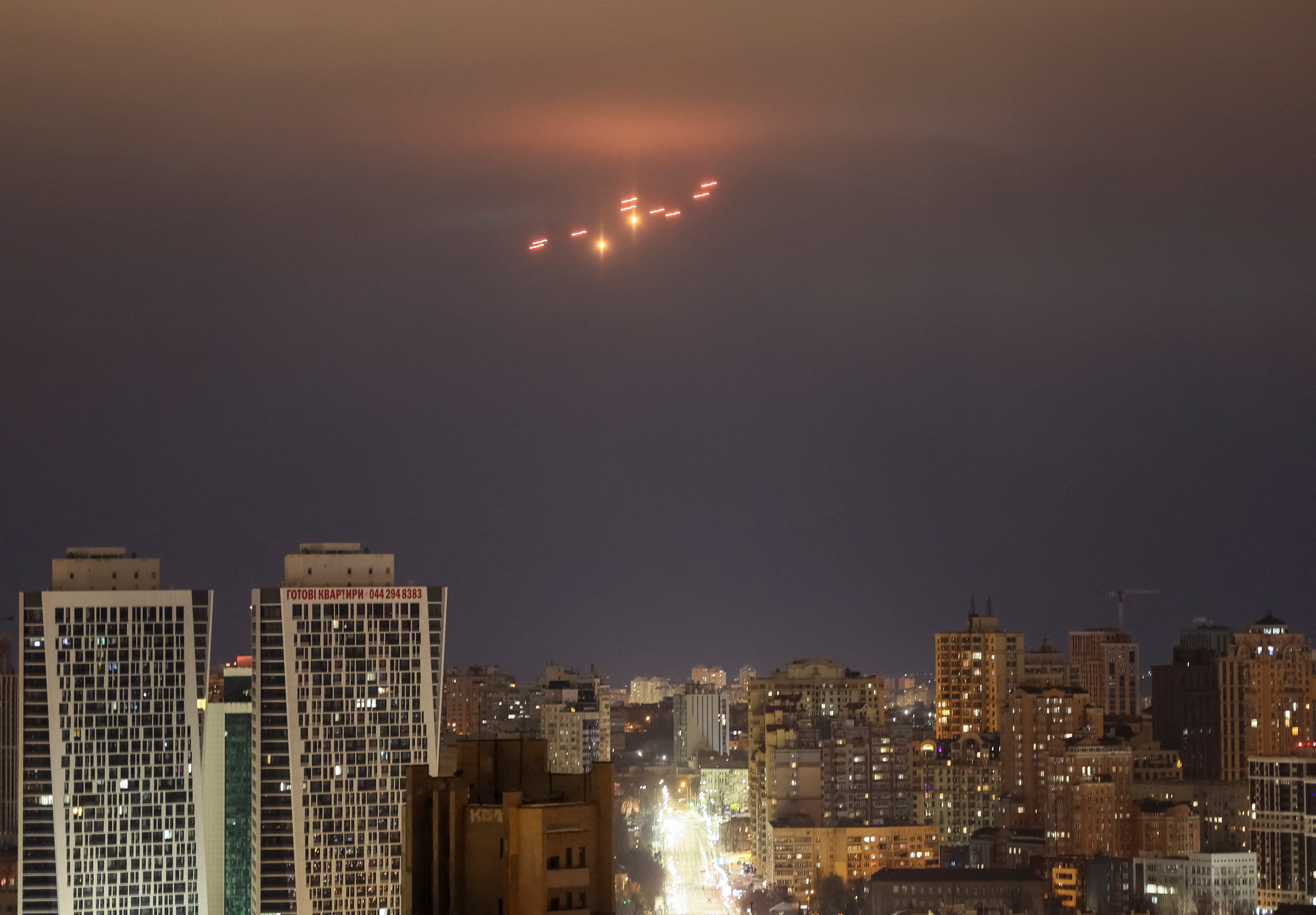 Explosions are seen in the sky over the city during a Russian drone strike, amid Russia’s attack on Ukraine