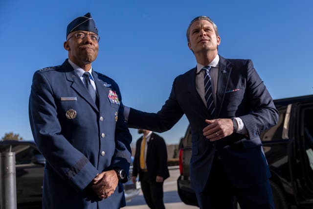 <p>Charles Q. Brown Jr., left, greets Trump’s new Secretary of Defense, Pete Hegseth, as he arrives for his first day at the Pentagon</p>