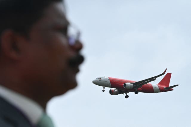 <p>An Air India Express aircraft prepares to land at Kempegowda International Airport in Bengaluru</p>