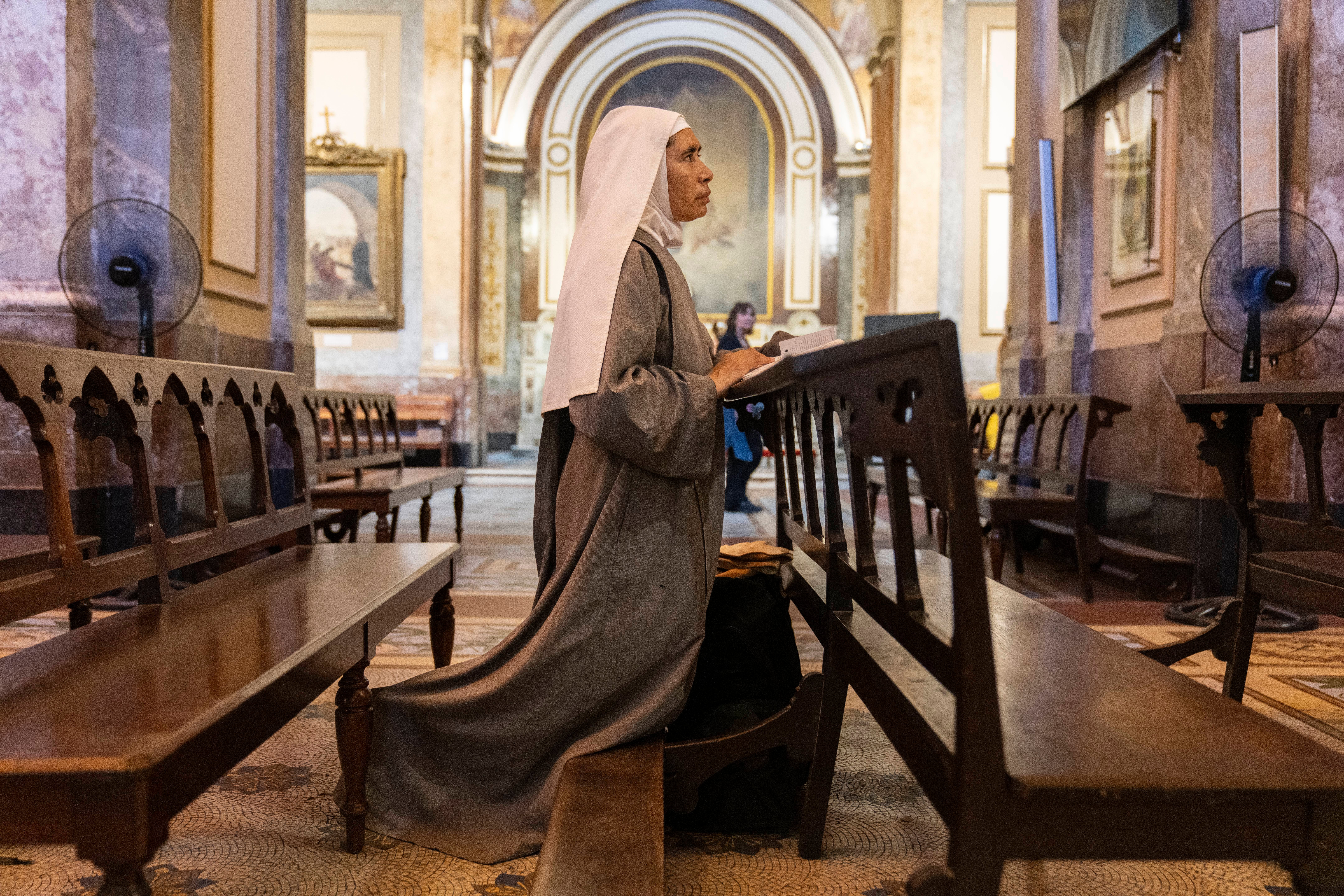 Missionary nun Maria Engracia, from Mexico, prays for the health of Pope Francis at the Metropolitan Cathedral in Buenos Aires, Buenos Aires