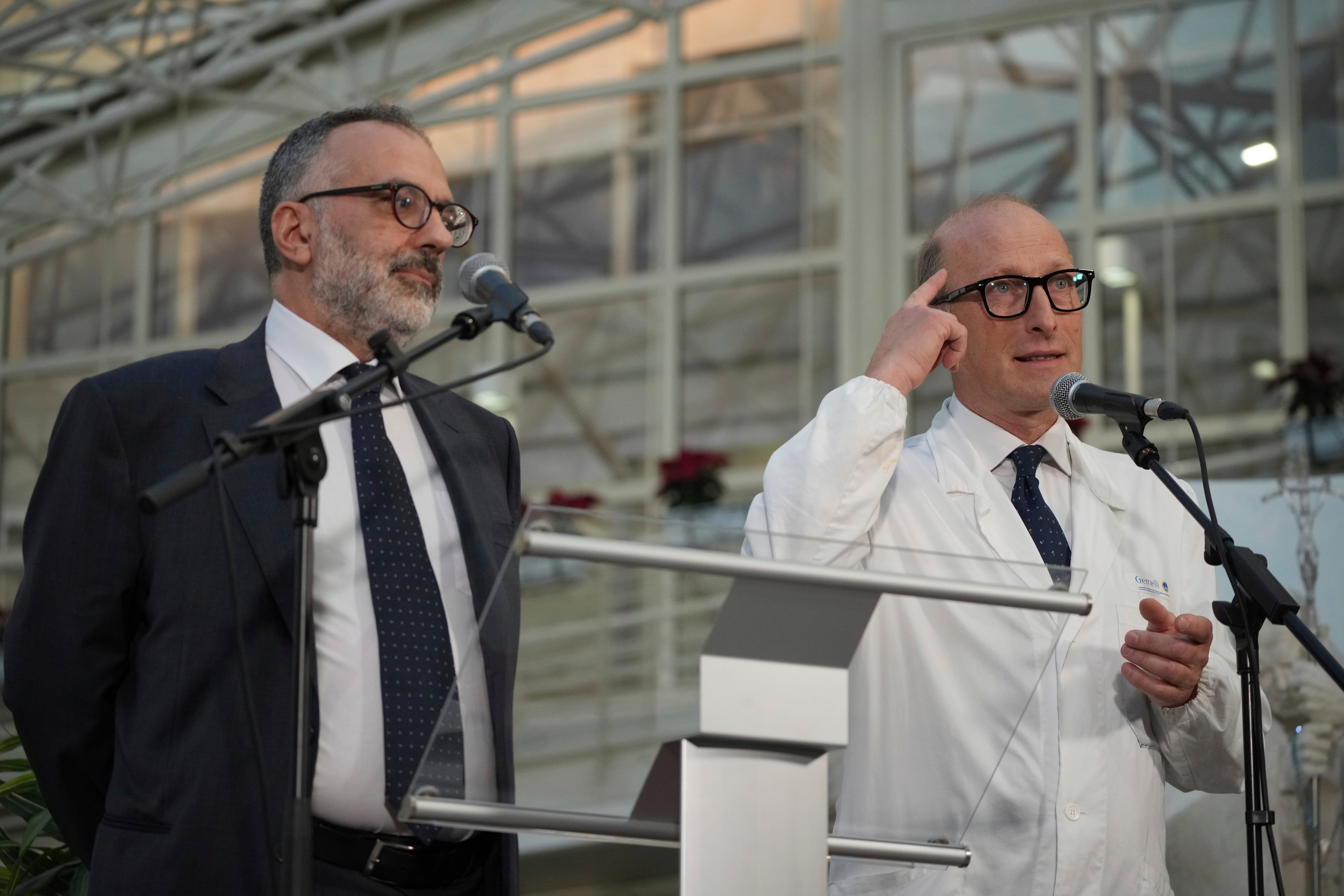 Surgeon Dr Sergio Alfieri, right, and Pope Francis’s personal doctor Luigi Carboni speak to journalists on Friday in Rome's Agostino Gemelli Polyclinic