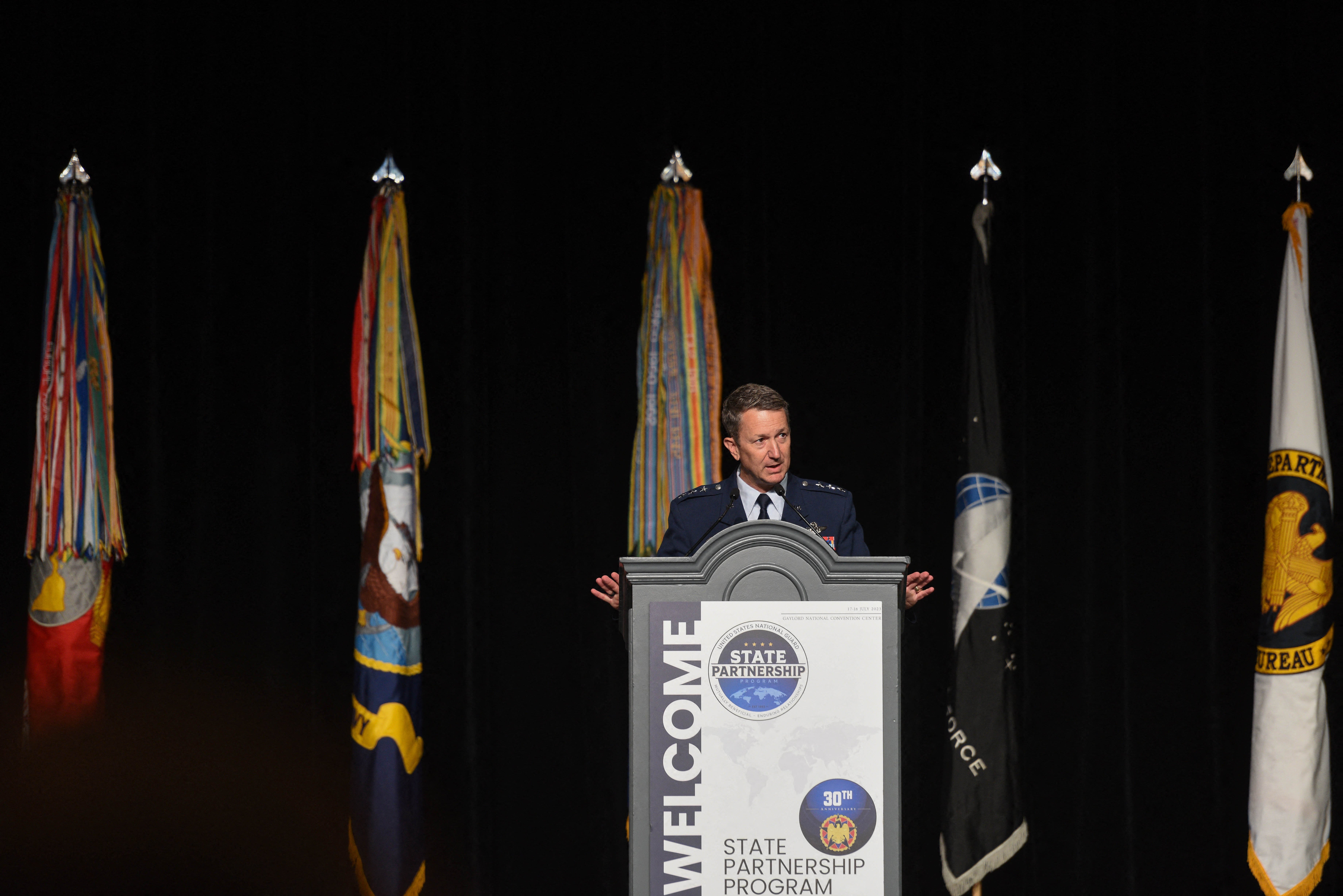 Caine speaks at the Department of Defense and National Guard State Partnership Program 30th Anniversary Conference. The general first met Trump in 2019