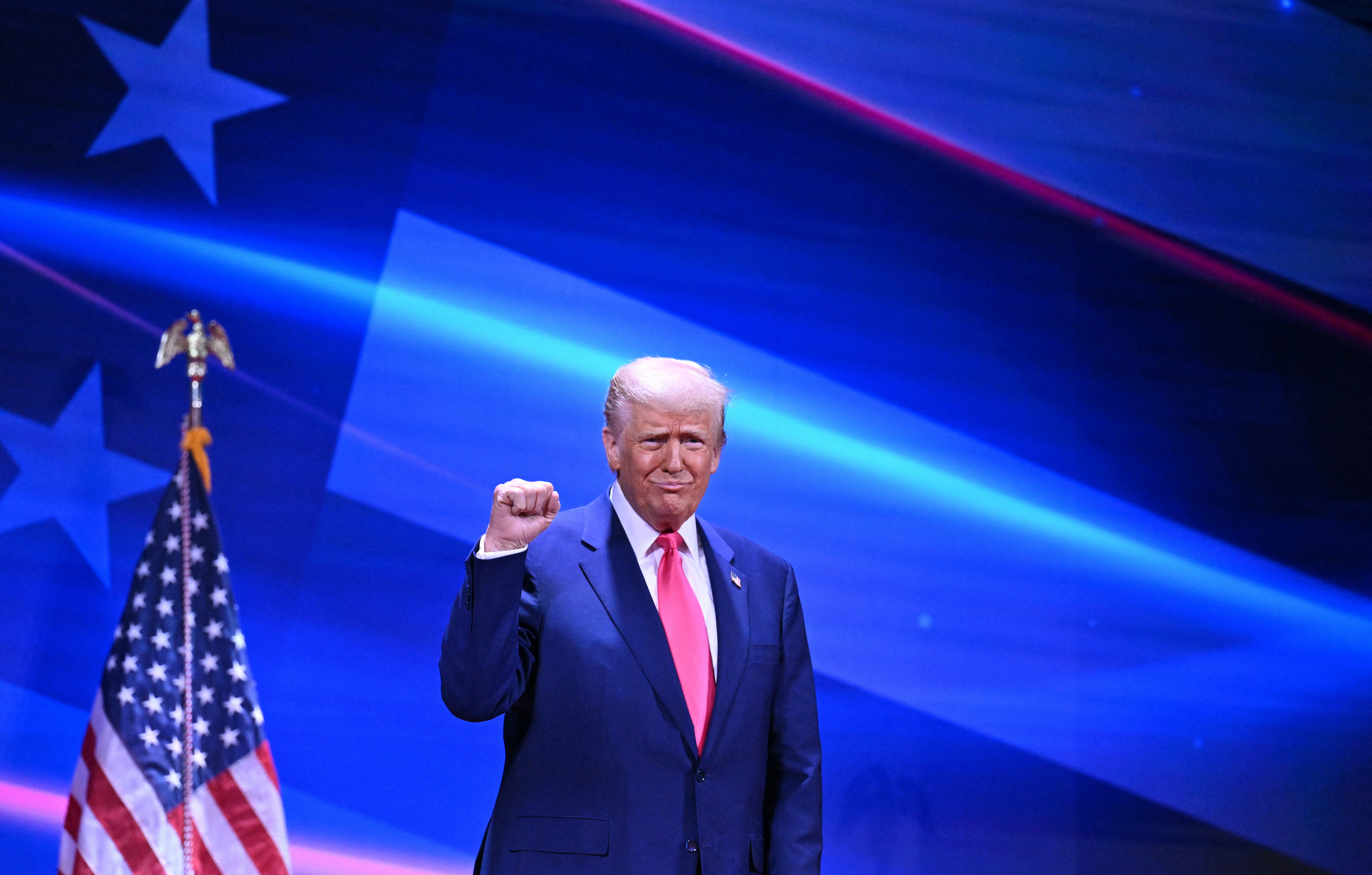 Trump gestures while speaking on the CPAC stage