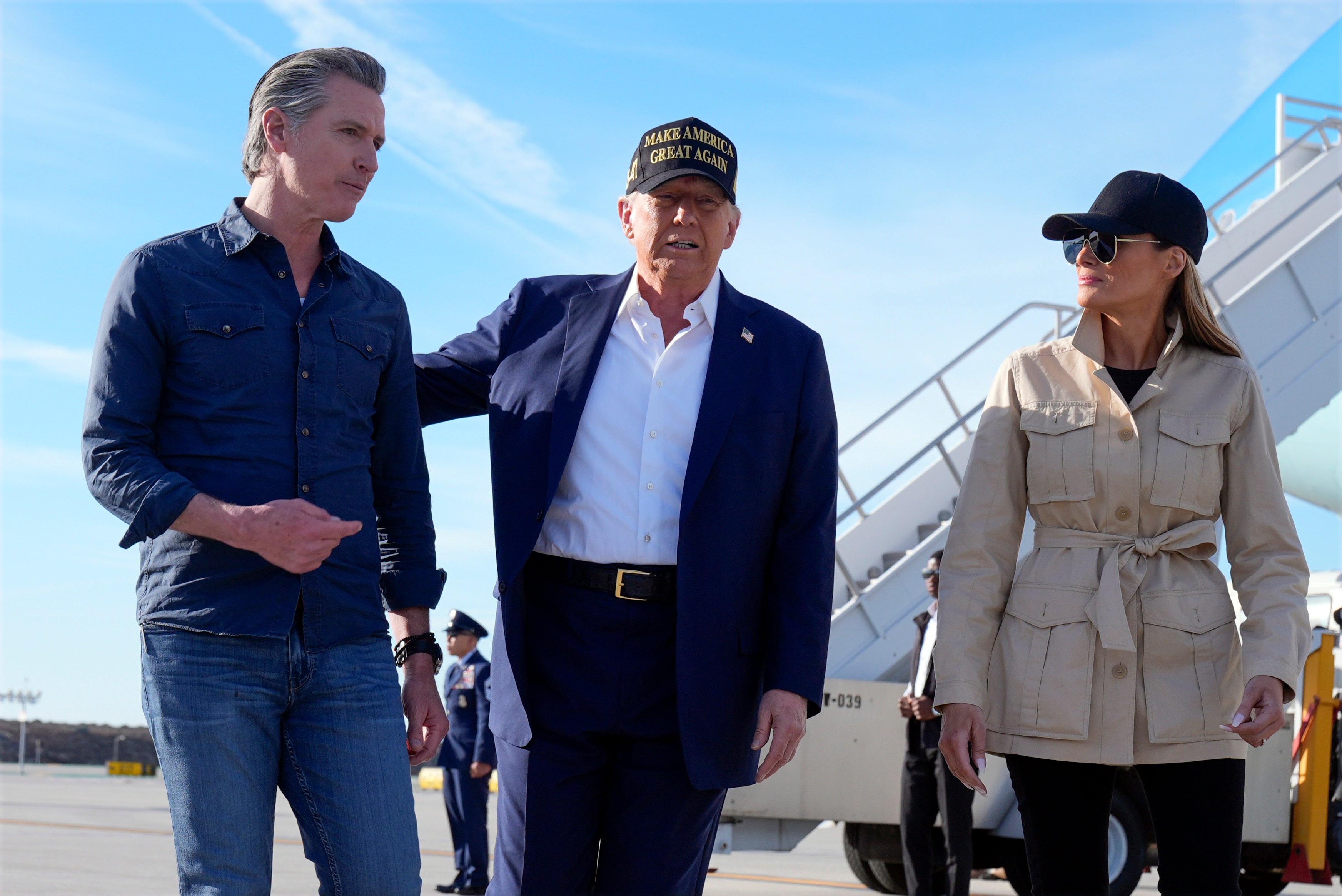 President Donald Trump and first lady Melania Trump walk with California Gov. Gavin Newsom after arriving on Air Force One at Los Angeles International Airport in January. It was the last time the First Lady had been seen until Saturday night.