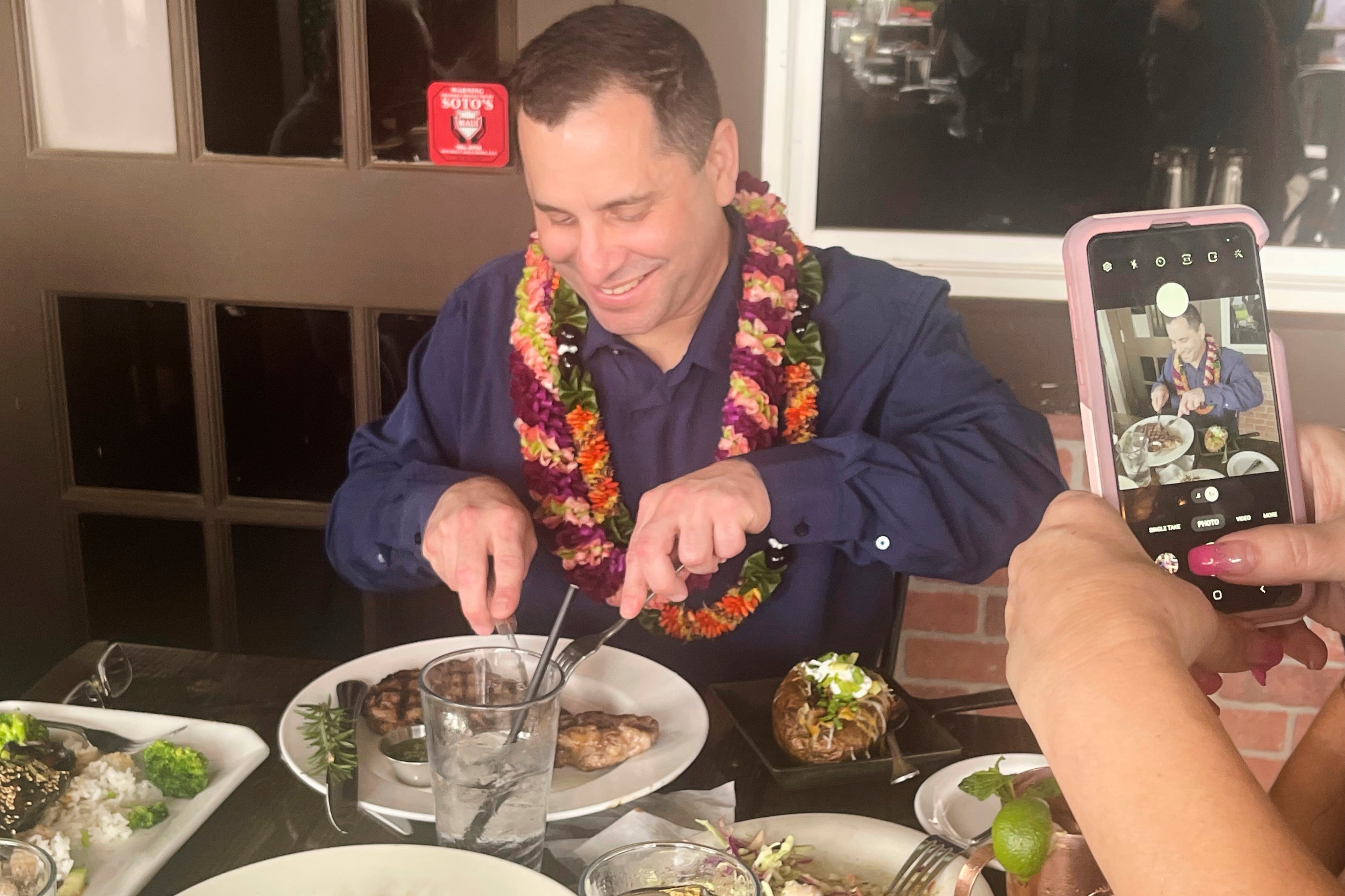 Gordon Cordeiro, who spent 30 years in prison for a murder he said he didn't commit, enjoys dinner at a steak house Friday, Feb. 21, 2025, in Kahului, Hawaii, hours after a judge ordered him released because of new evidence. (Kenneth Lawson via AP)