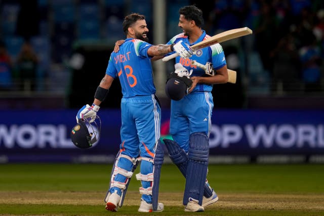 Virat Kohli, left, helped India beat Pakistan (Altaf Qadri/AP)