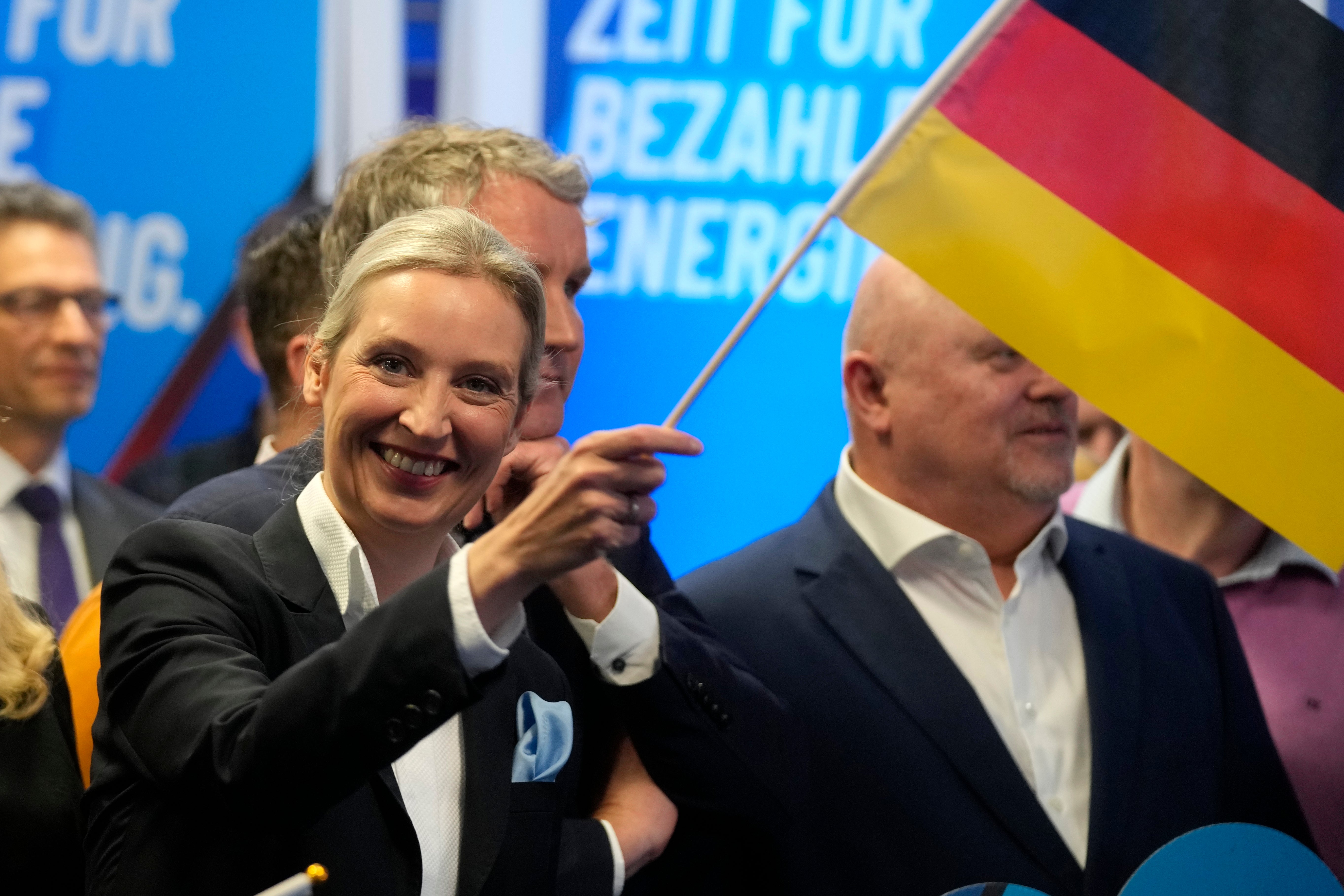 Leader of far-right AfD Alice Weidel waves a German flag at her party’s headquarters