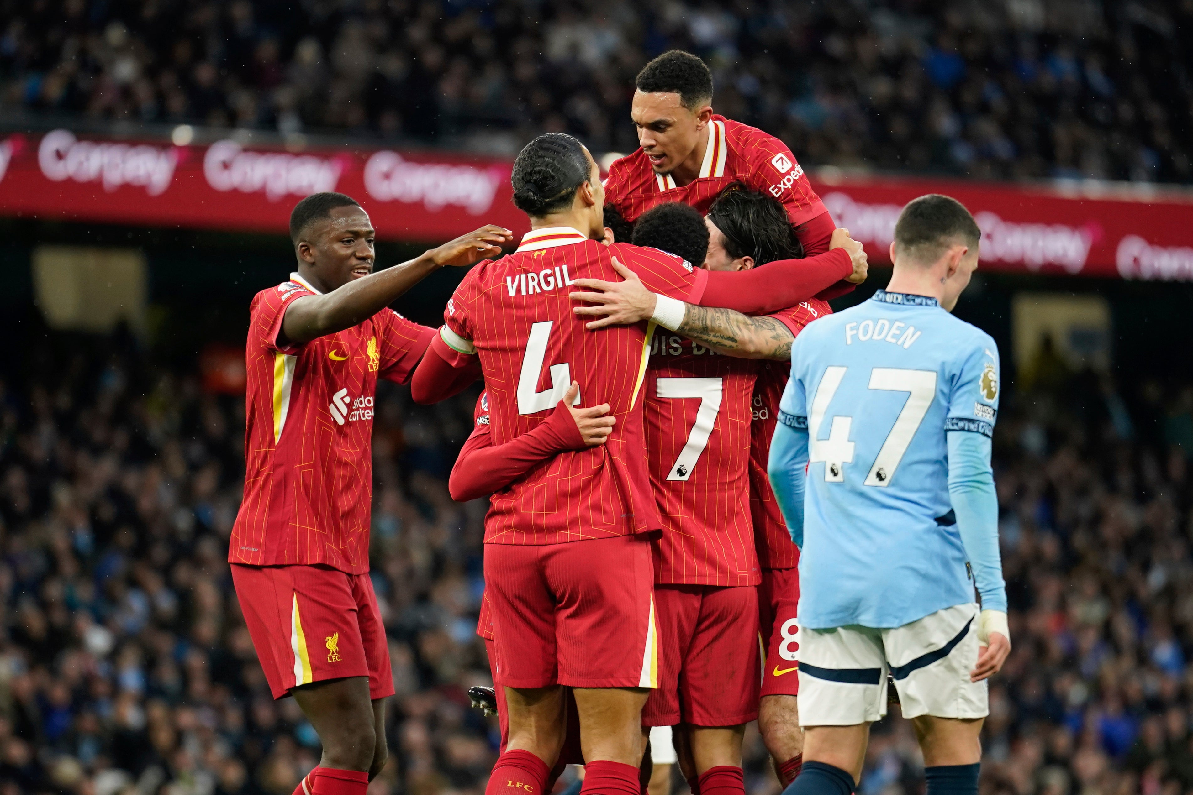 Liverpool celebrate against Man City as Phil Foden appears dejected