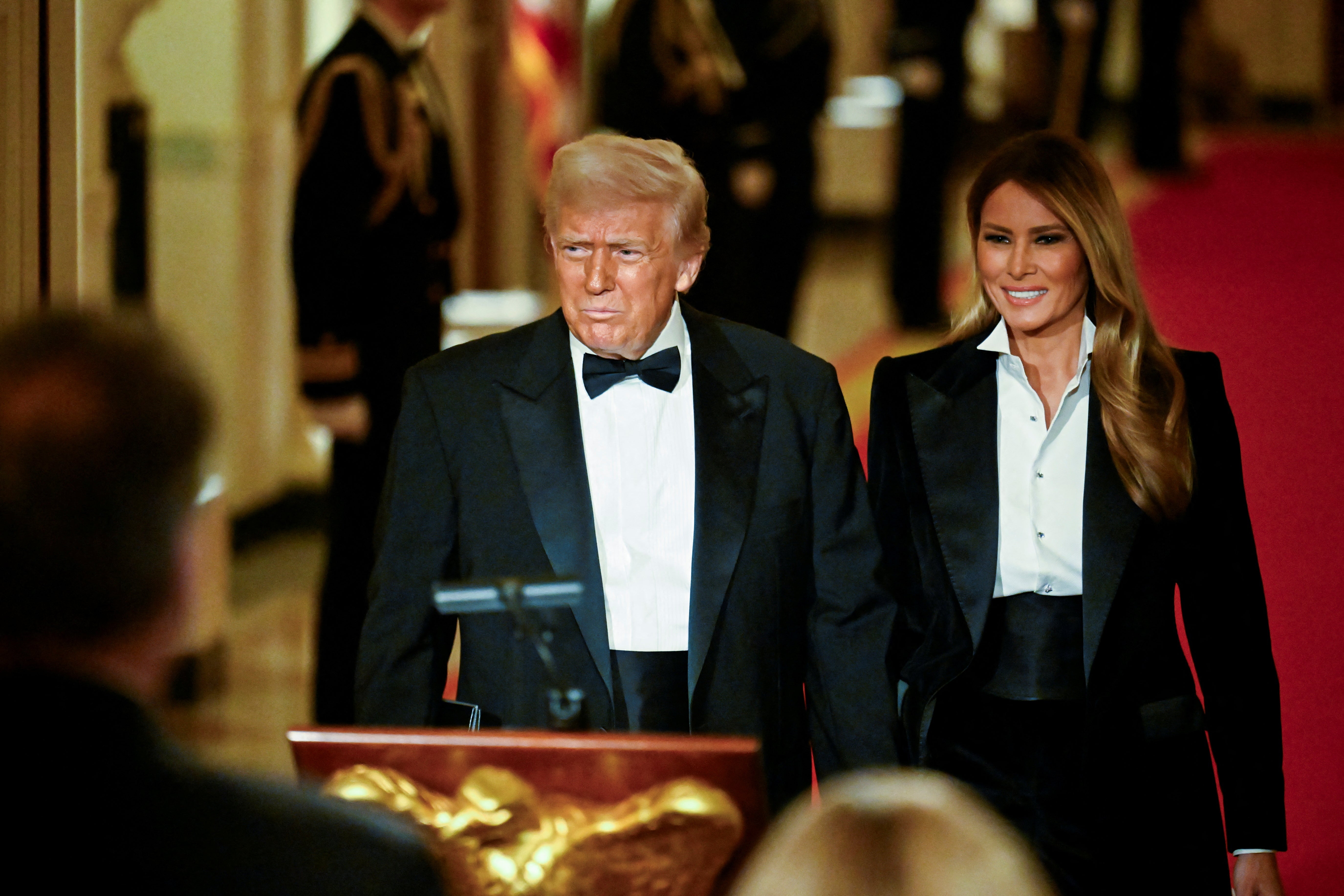 President Donald Trump and First Lady Melania Trump arrive for dinner at the National Governors Association. It was the first time the First Lady had been seen in a month.