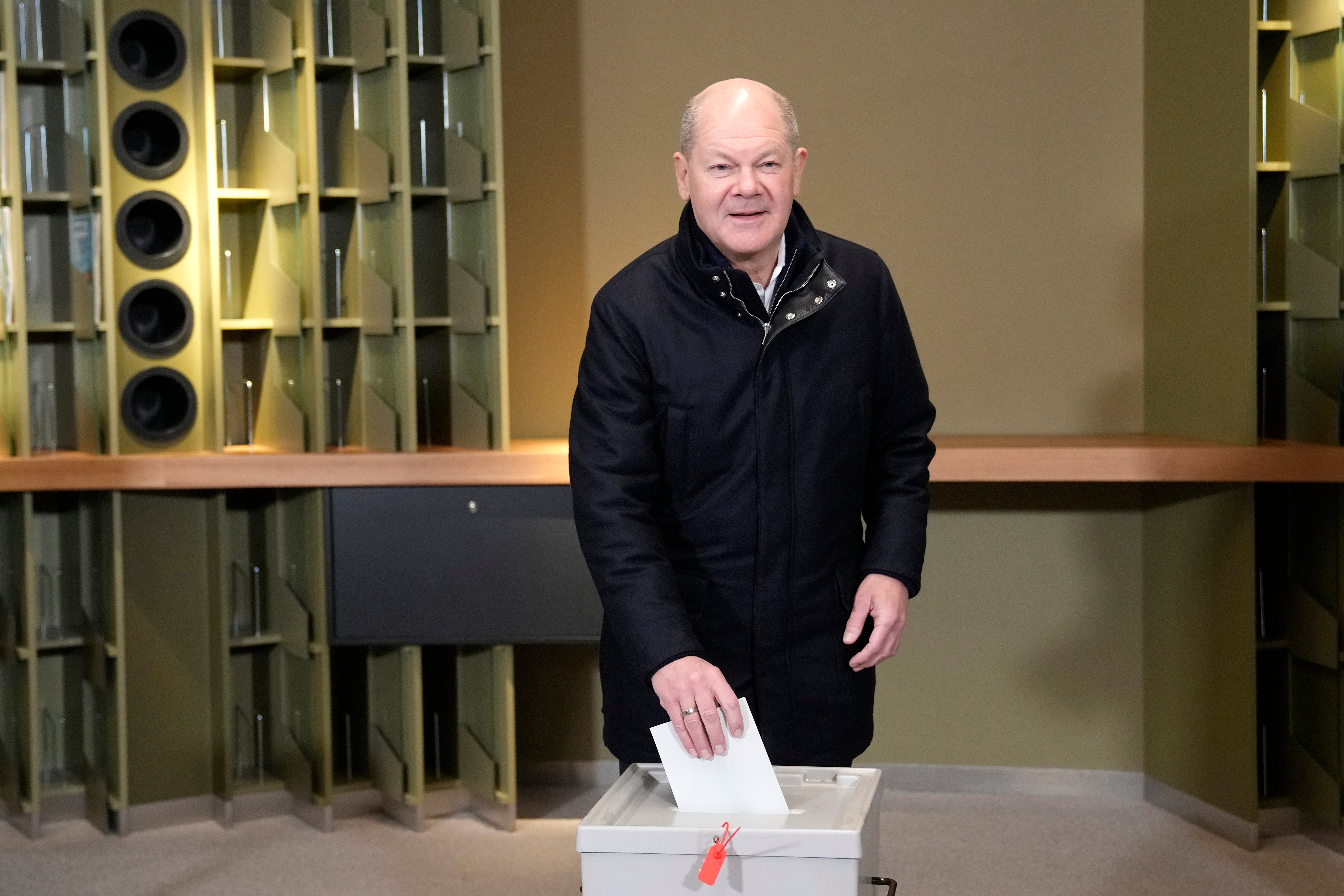 German chancellor Olaf Scholz casts his vote at a polling station in Berlin, Germany, Sunday