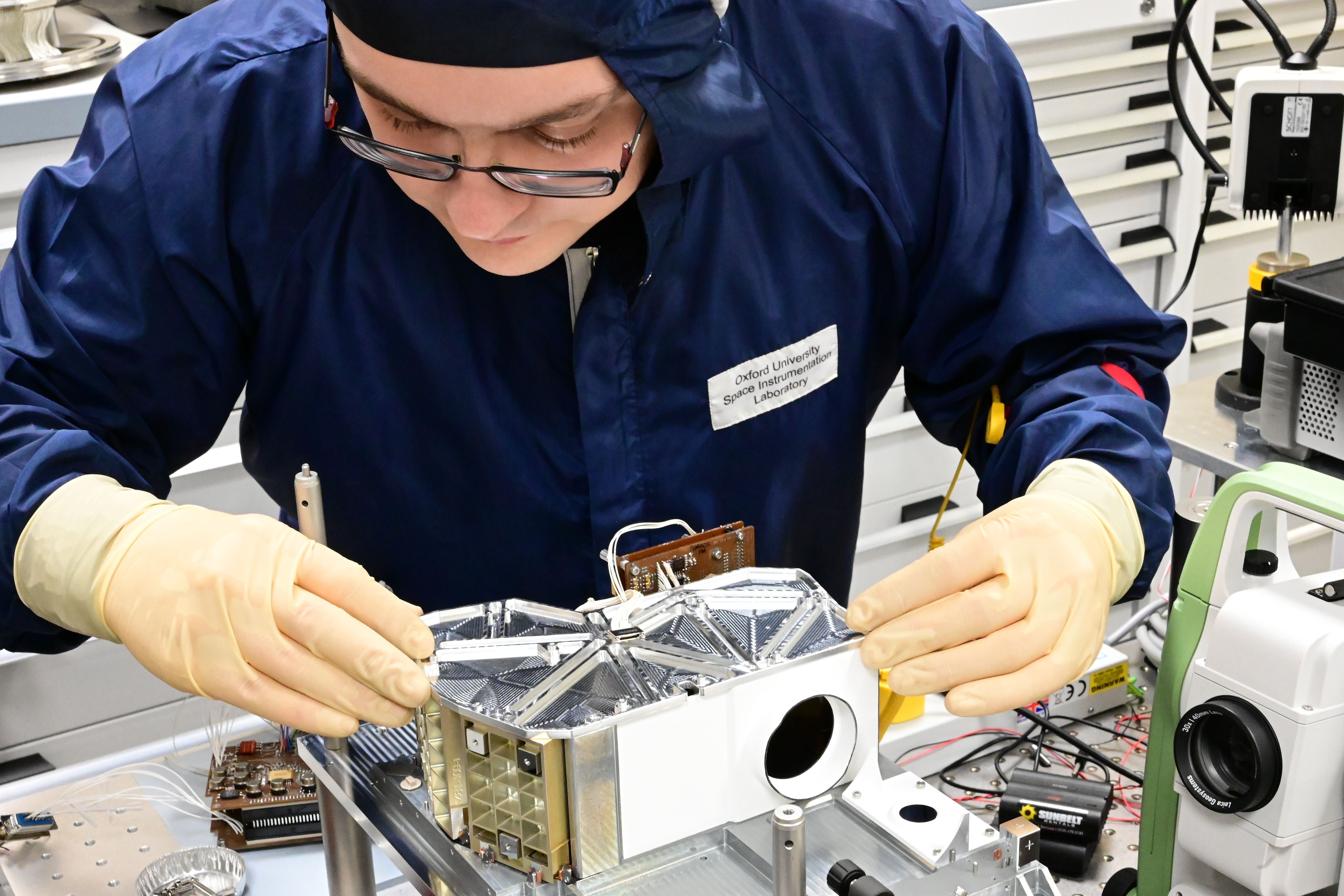 Dr Rory Evans performing optical assembly and alignment on a component of the Lunar Trailblazer spacecraft (Department of Physics/University of Oxford/PA)