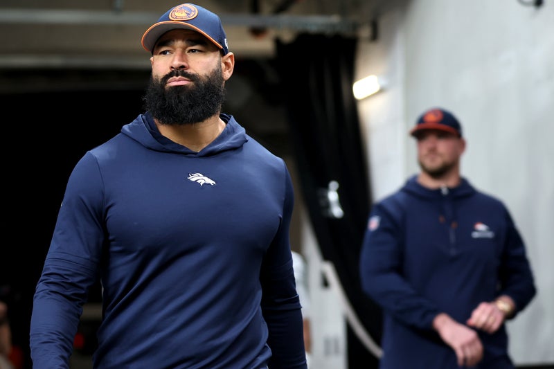 Broncos assistant coach Michael Wilhoite arrested after being accused of punching a police officer