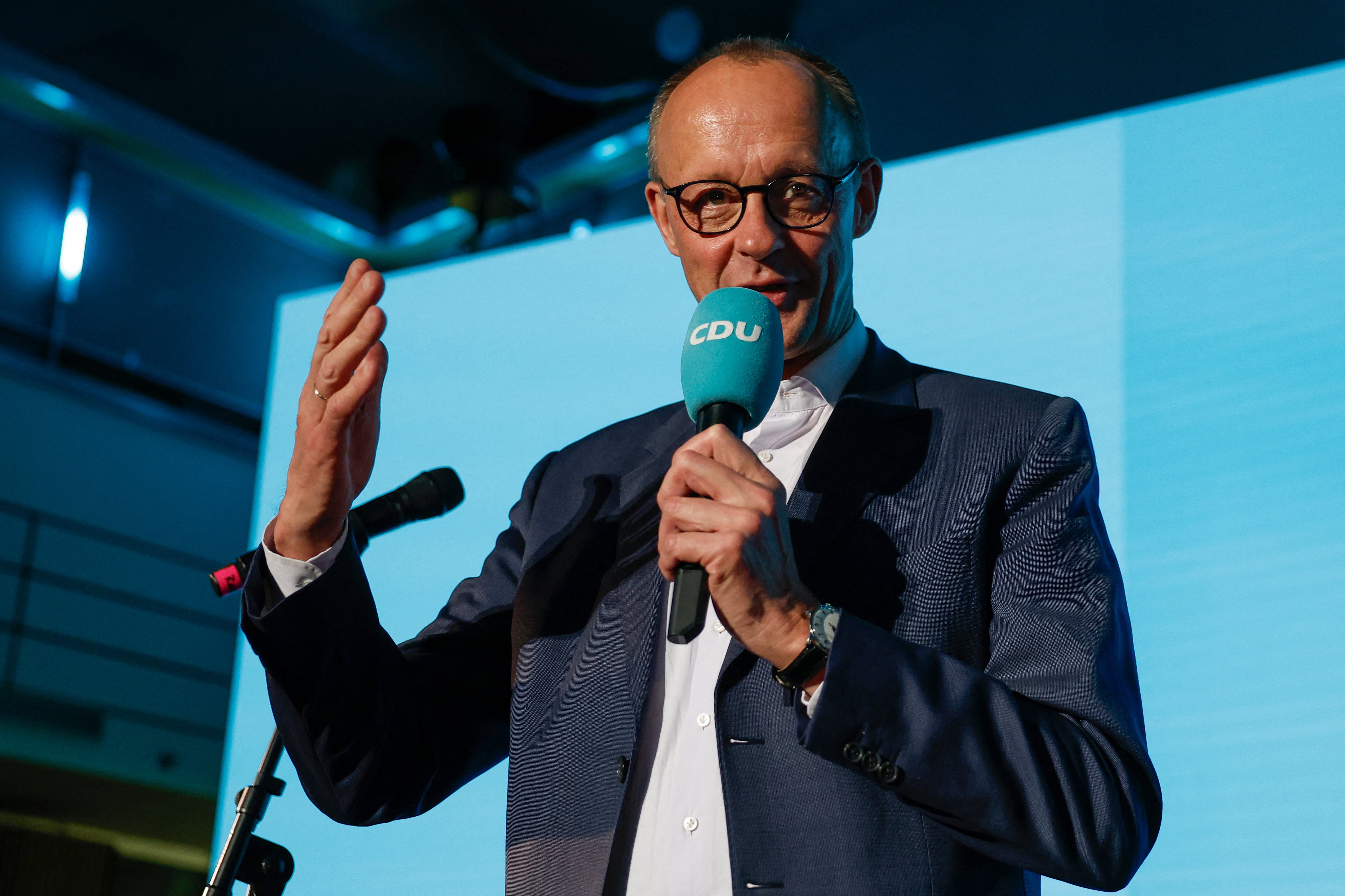 Friedrich Merz, leader of Germany's conservative Christian Democratic Union (CDU) and his party's main candidate for chancellor addresses supporters at the electoral evening in Berlin