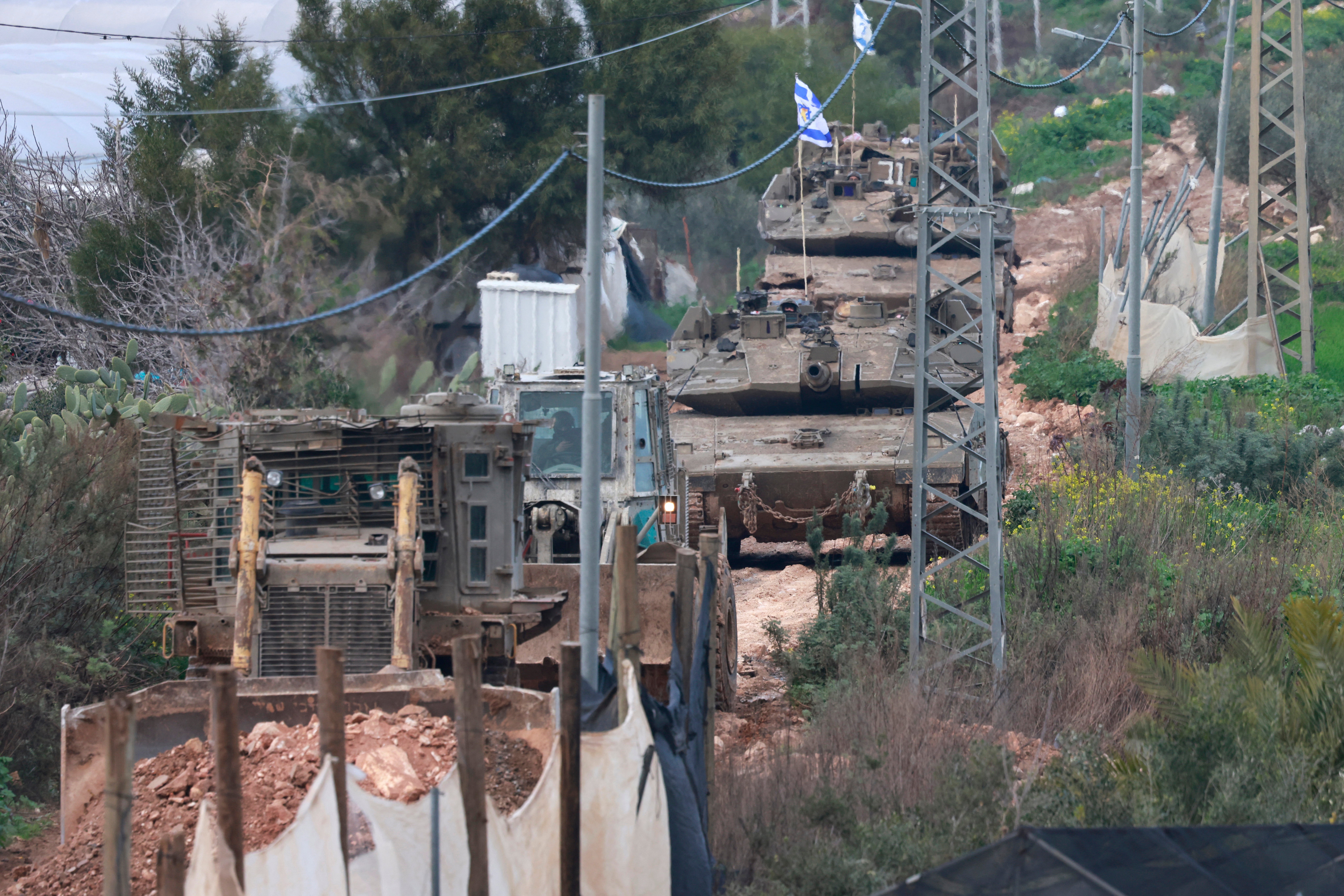 <p>An Israeli bulldozer tears up a street as tanks enter the Jenin camp for Palestinian refugees in the occupied West Bank on 23 February 2025</p>