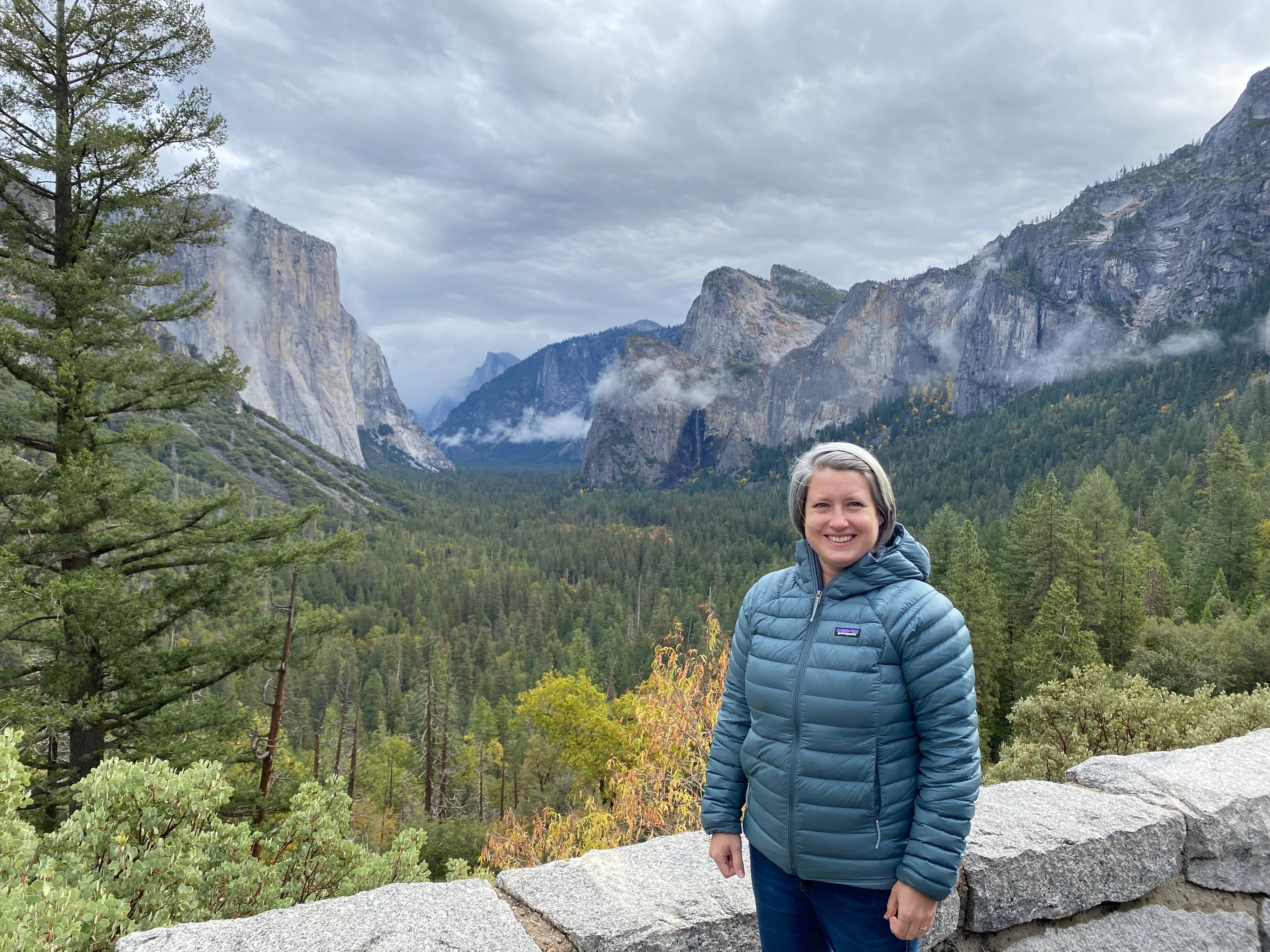 Emily Douce poses for a photo at Yosemite National Park in northern California. Douce says budgets cuts over recent years have already been detrimental. They came even as the number of visit rose by 6 percent in recent years