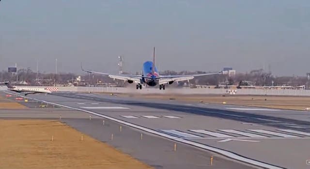 <p>A Southwest plane was forced to go back into the air after a private jet appeared on the runway seconds before landing</p>