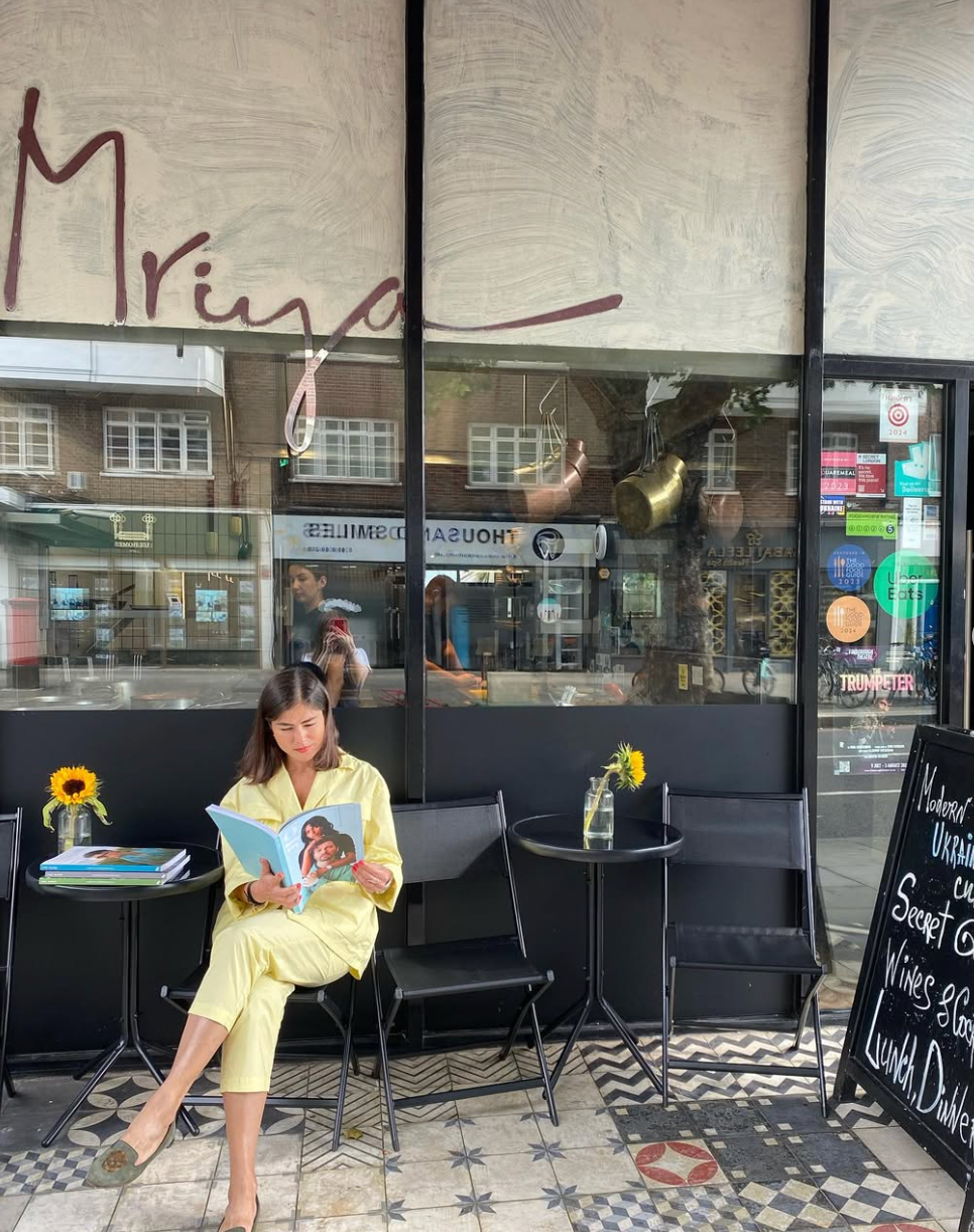 Olga sits outside Mirya- Ukrainian for dream