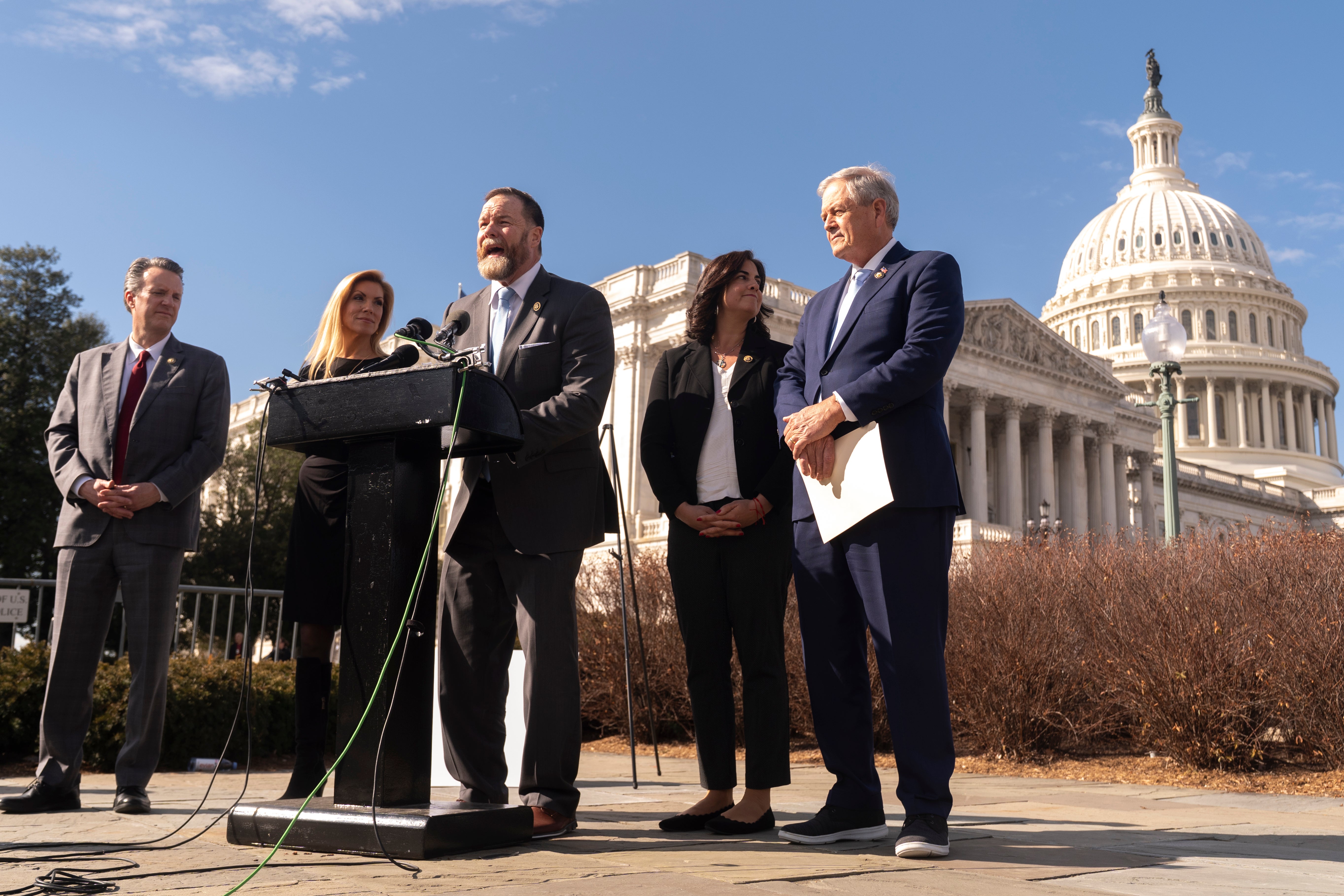 Department of Government Efficiency (DOGE) Caucus co-chair Rep. Aaron Bean, R-Fla., center, with other Republican lawmakers, speaks during a news conference to unveil the DOGE Caucus initiatives, on Capitol Hill