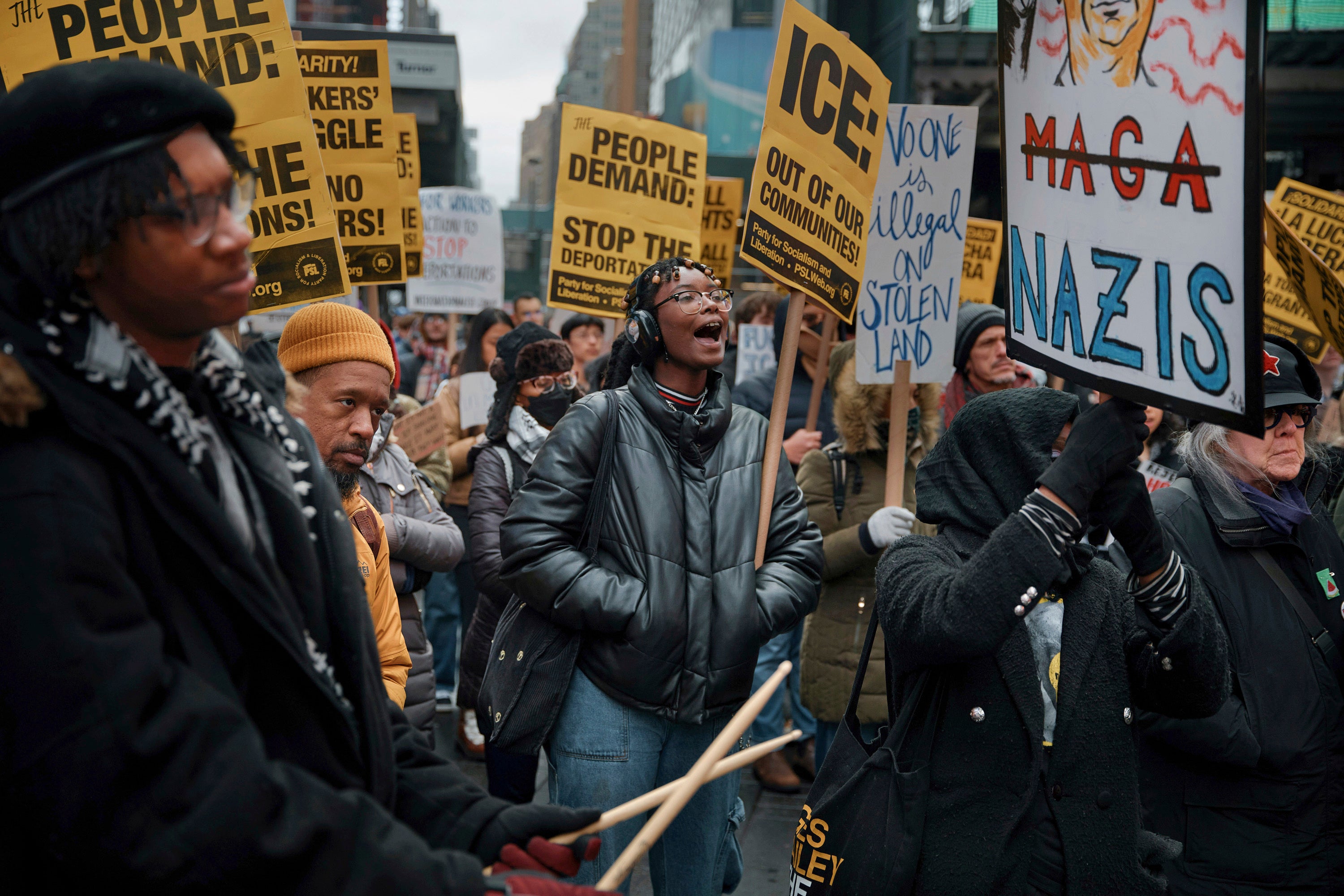 Protesters shout slogans during a pro-migrant rally, demanding an end to deportations in New York