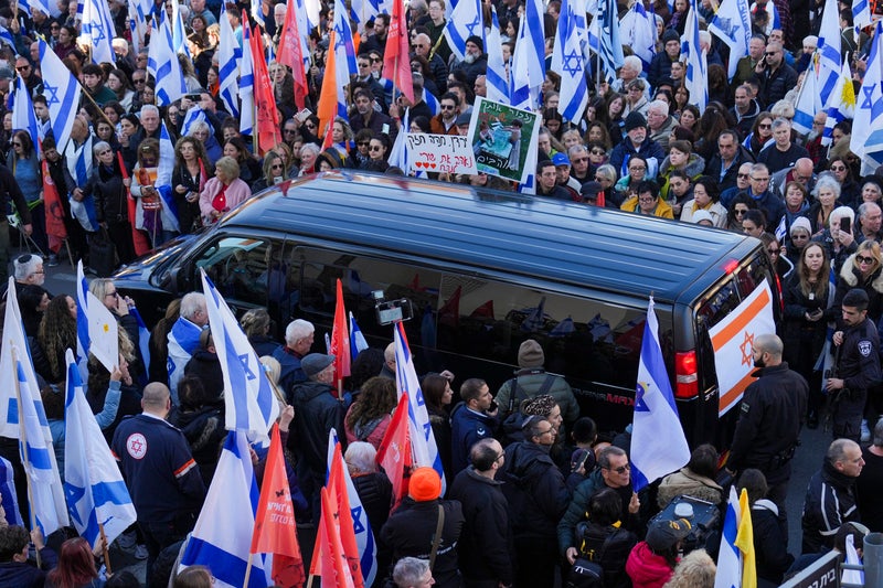 Thousands line streets to farewell Shiri Bibas and her young sons, killed in Gaza