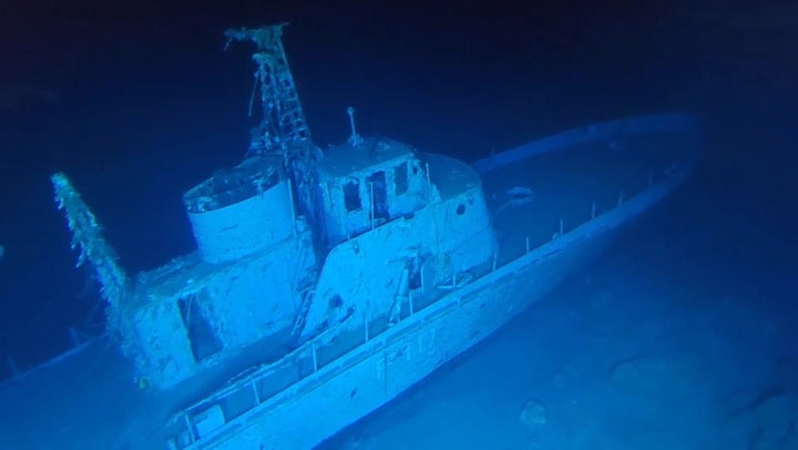 <p>Divers stumble across ghost navy ship wreckage as it emerges from depths of ocean.</p>