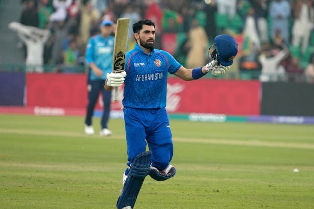 Afghanistan’s Ibrahim Zadran celebrates after scoring century (K.M. Chaudary/AP)