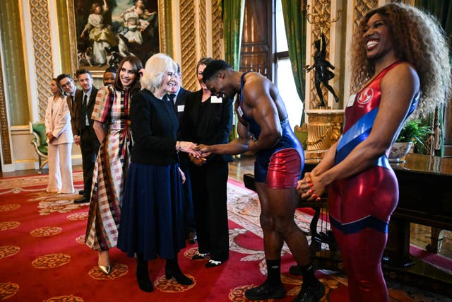 The Queen meets Gladiators Nitro aka Harry Aikines-Aryeetey and Fire aka Montell Douglas. Picture date: Wednesday February 26, 2025. (Justin Tallis/PA)