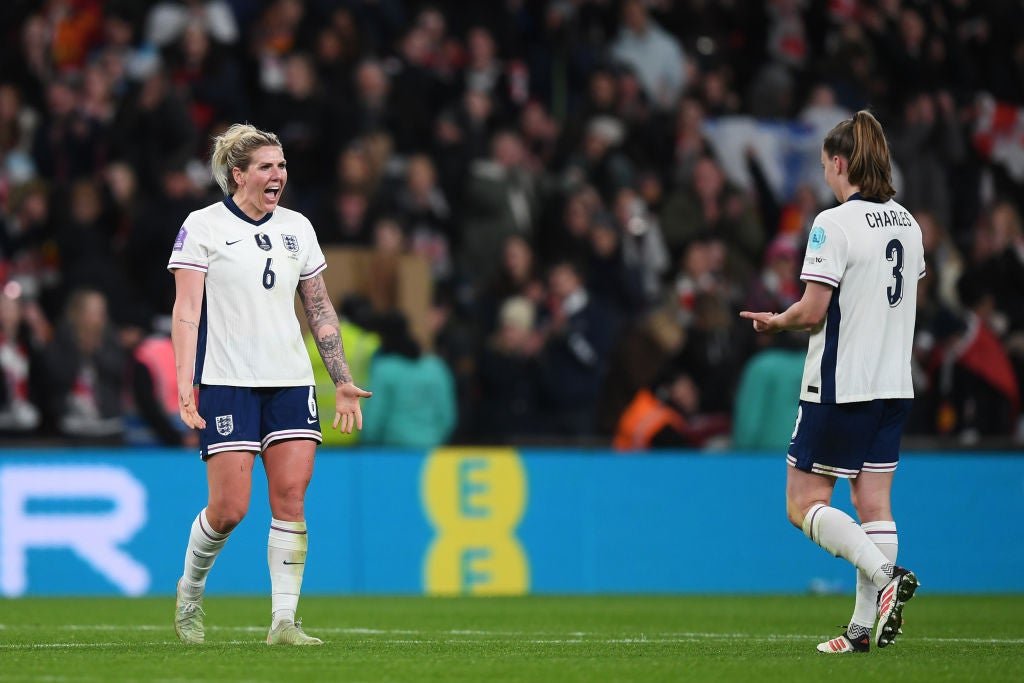 Millie Bright, left, and Niamh Charles celebrate England's victory