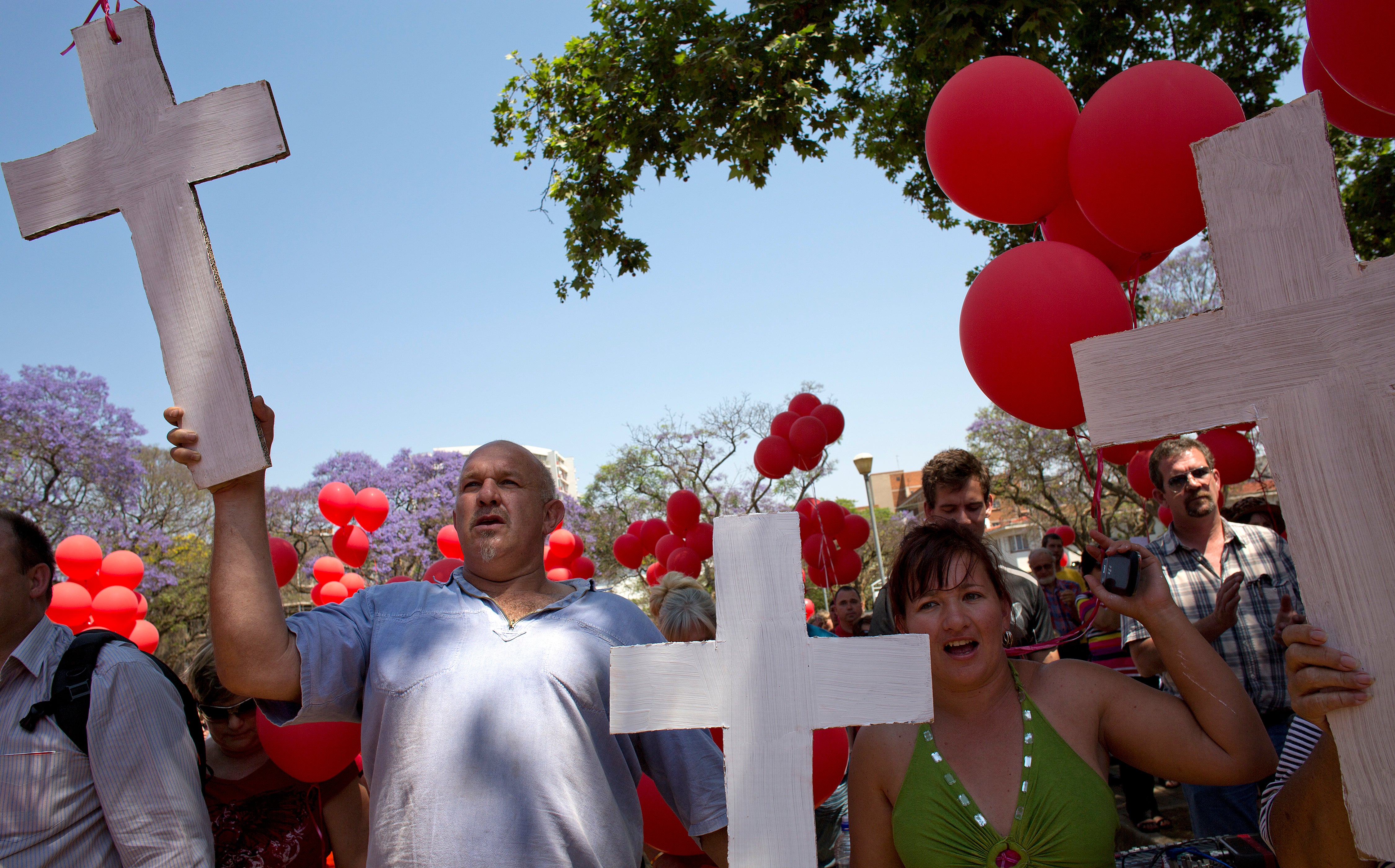 File. White South Africans holding crosses march to protest against the violent murder of farmers which they term ‘genocide and oppressive state policies in favour of blacks’ in Pretoria in 2013