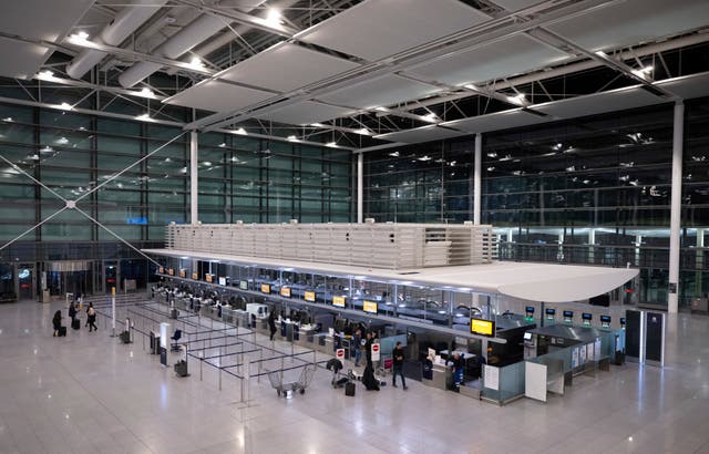 <p>Passengers arrive at  Munich Airport on Thursday</p>