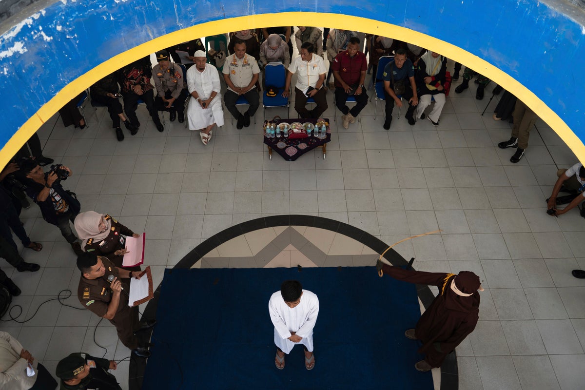 Sharia court sentences men to public caning after they were caught kissing