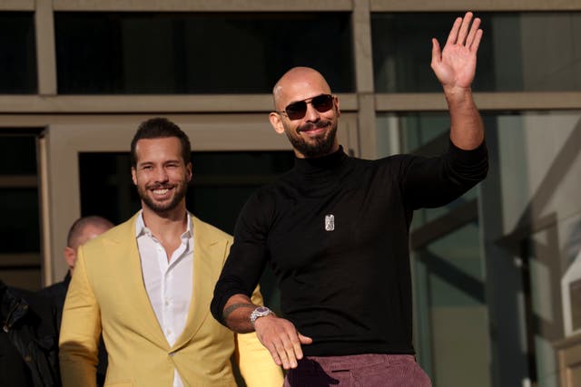 <p>Andrew Tate waves as he exits the Bucharest Tribunal with his brother Tristan, in Bucharest, Romania, Thursday, Jan. 9, 2025</p>