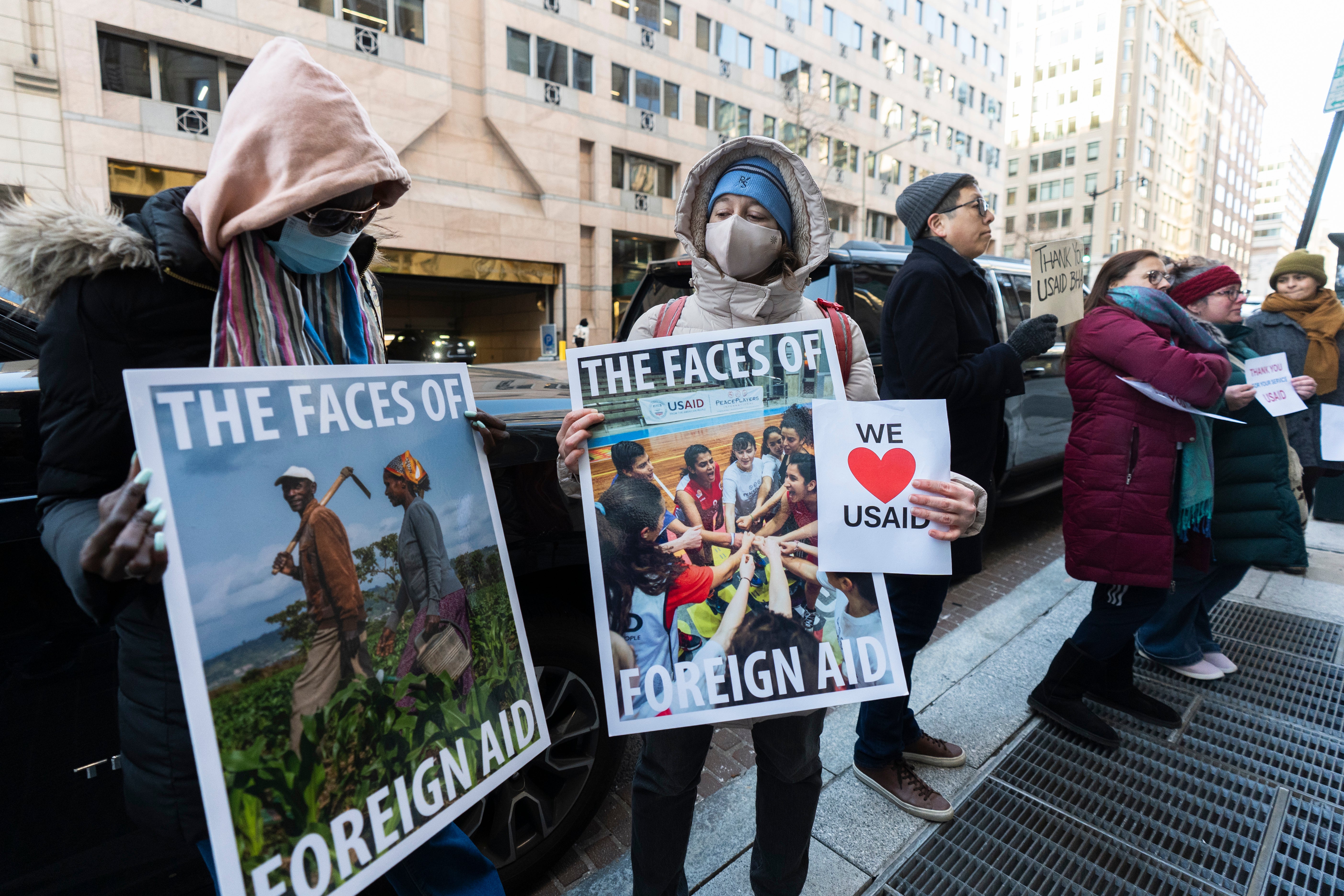 Protesters outside a USAID office in Washington, D.C. on February 21 offered support to fired workers as Trump and Musk gut the global aid agency